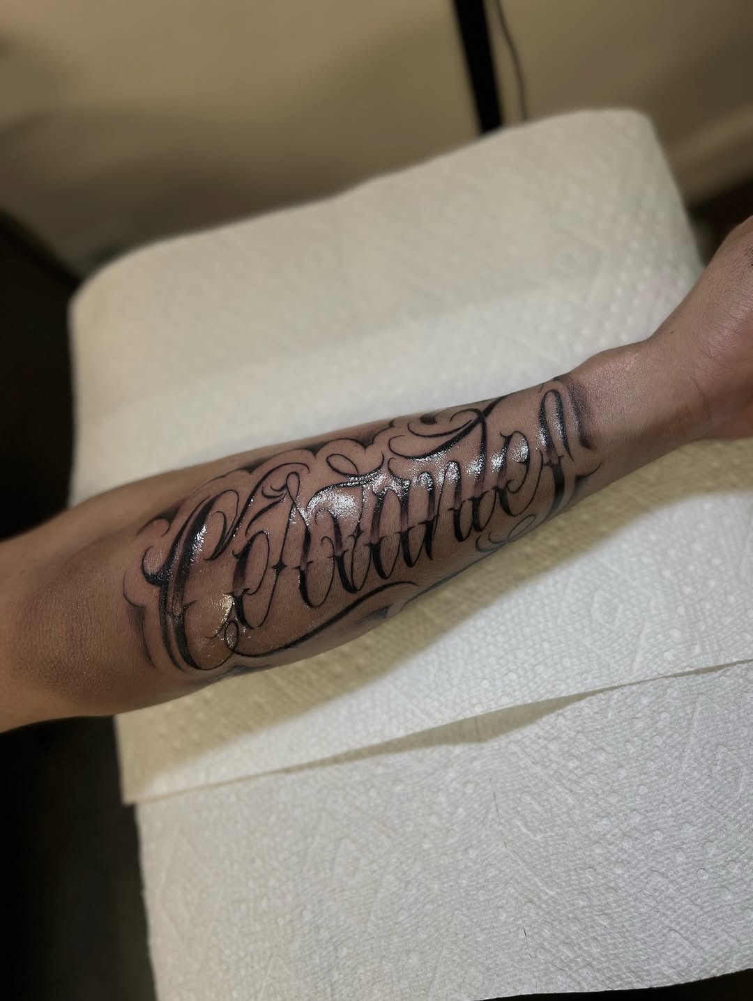 Script lettering lettering tattoo on the forearm by Mr Letters🗡️