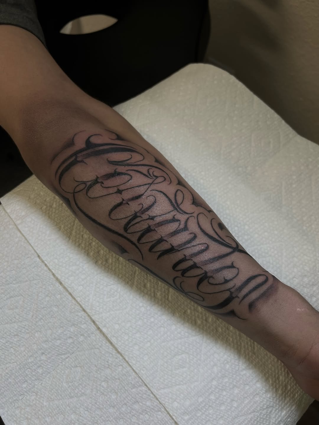 Script lettering lettering tattoo on the forearm by Mr Letters🗡️