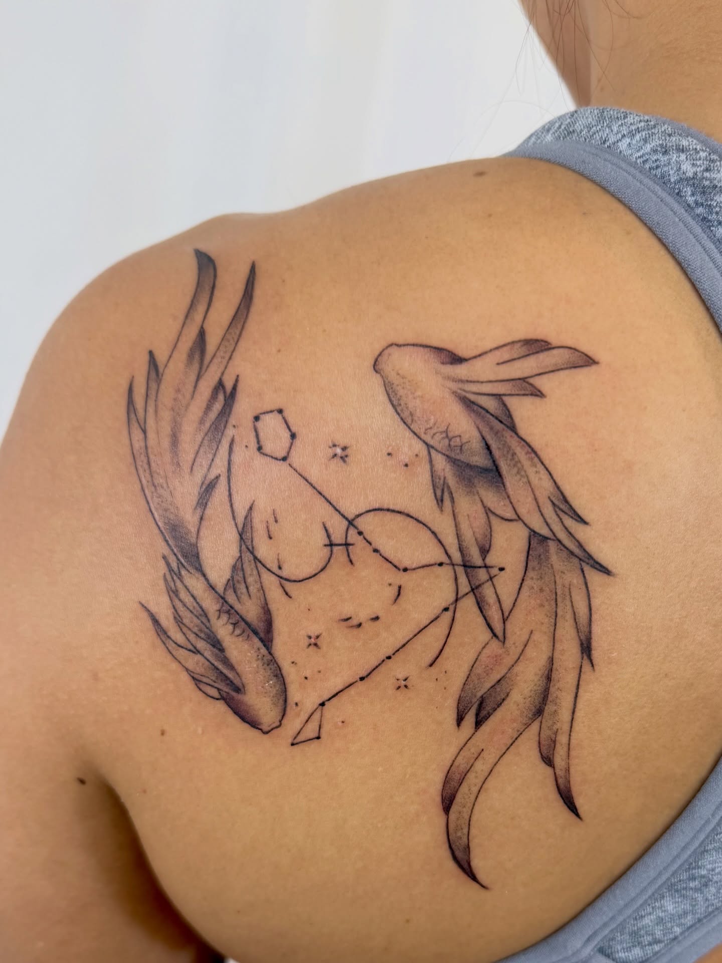 Astronomical constellation black and grey tattoo on the shoulder by Jerry Thomas