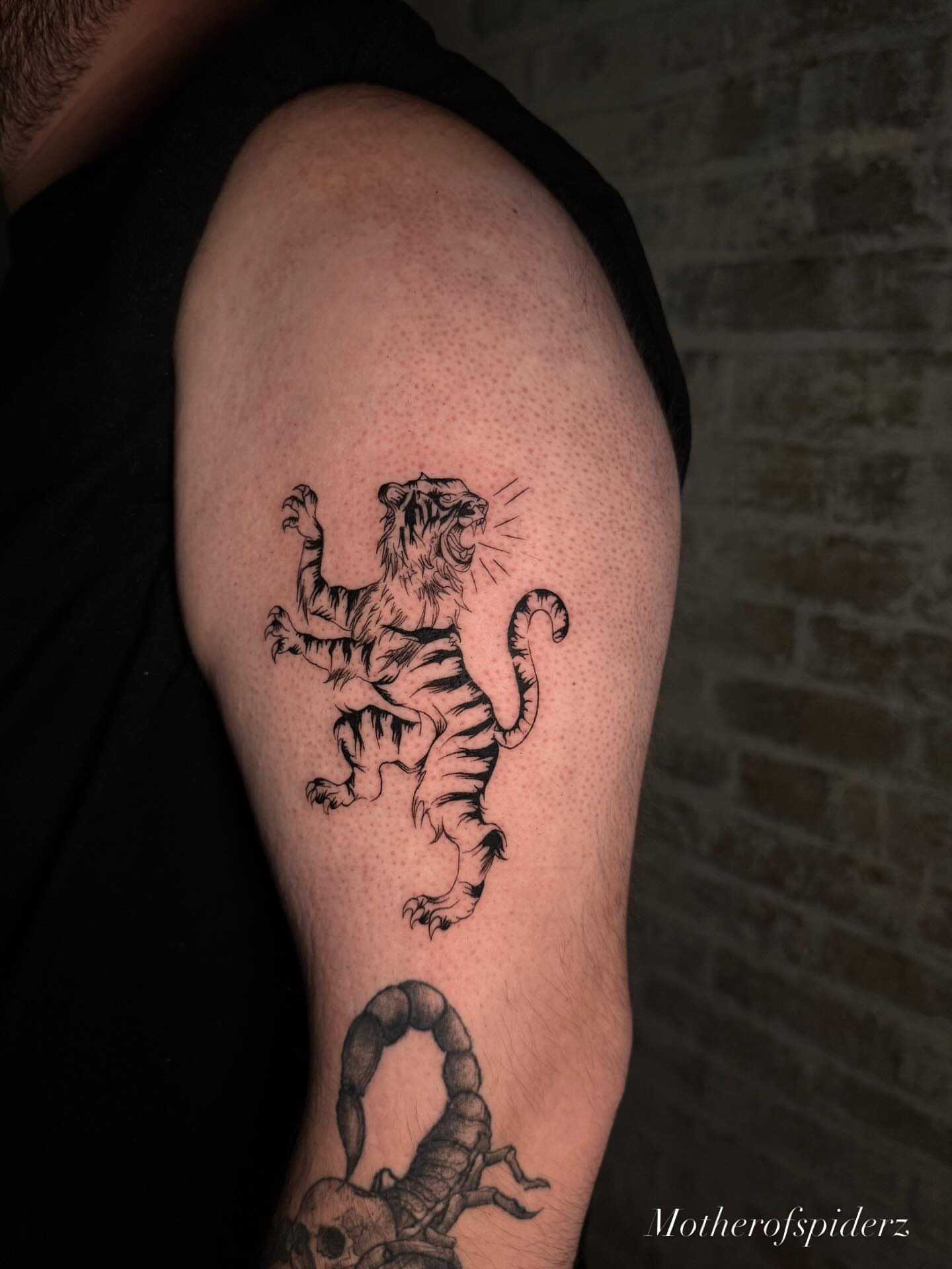 Tiger dotwork tattoo on the thigh by Alyssa Garza