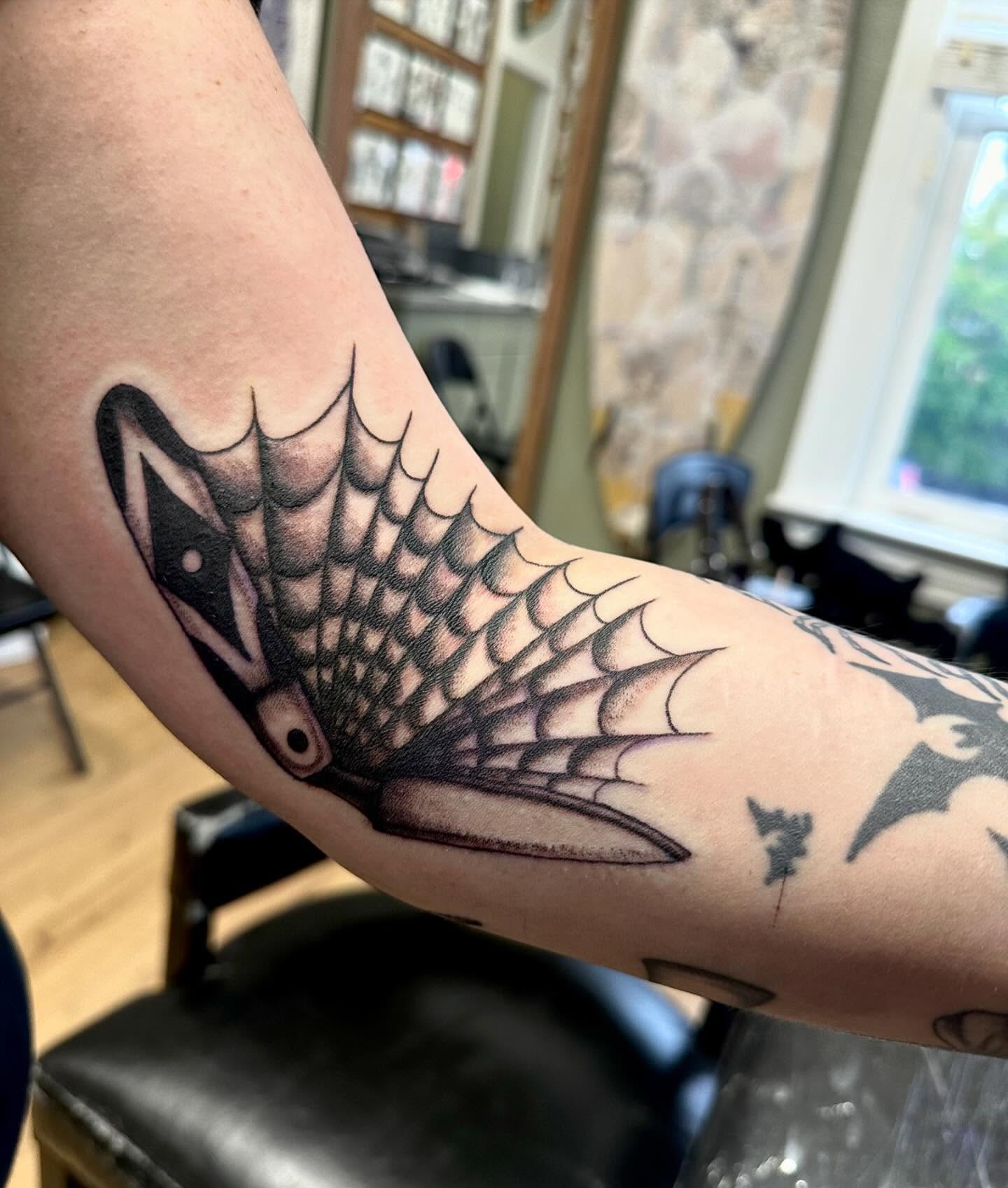 Fish American traditional tattoo on the forearm by Kaylee Woods