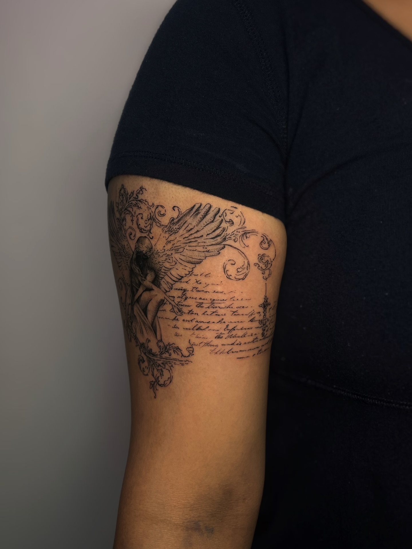 Angel with scroll realism tattoo on the forearm by MK