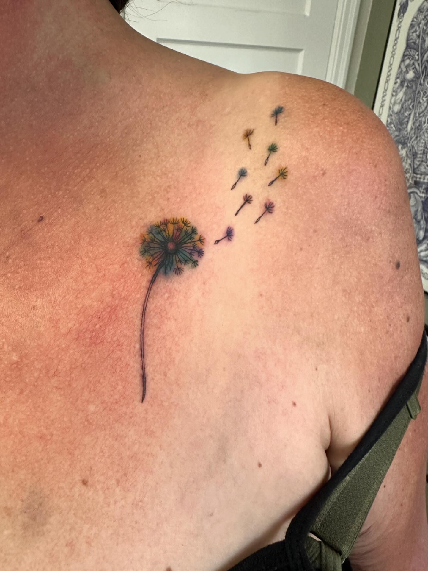 Dandelion dotwork tattoo on the shoulder by Kaylee Woods