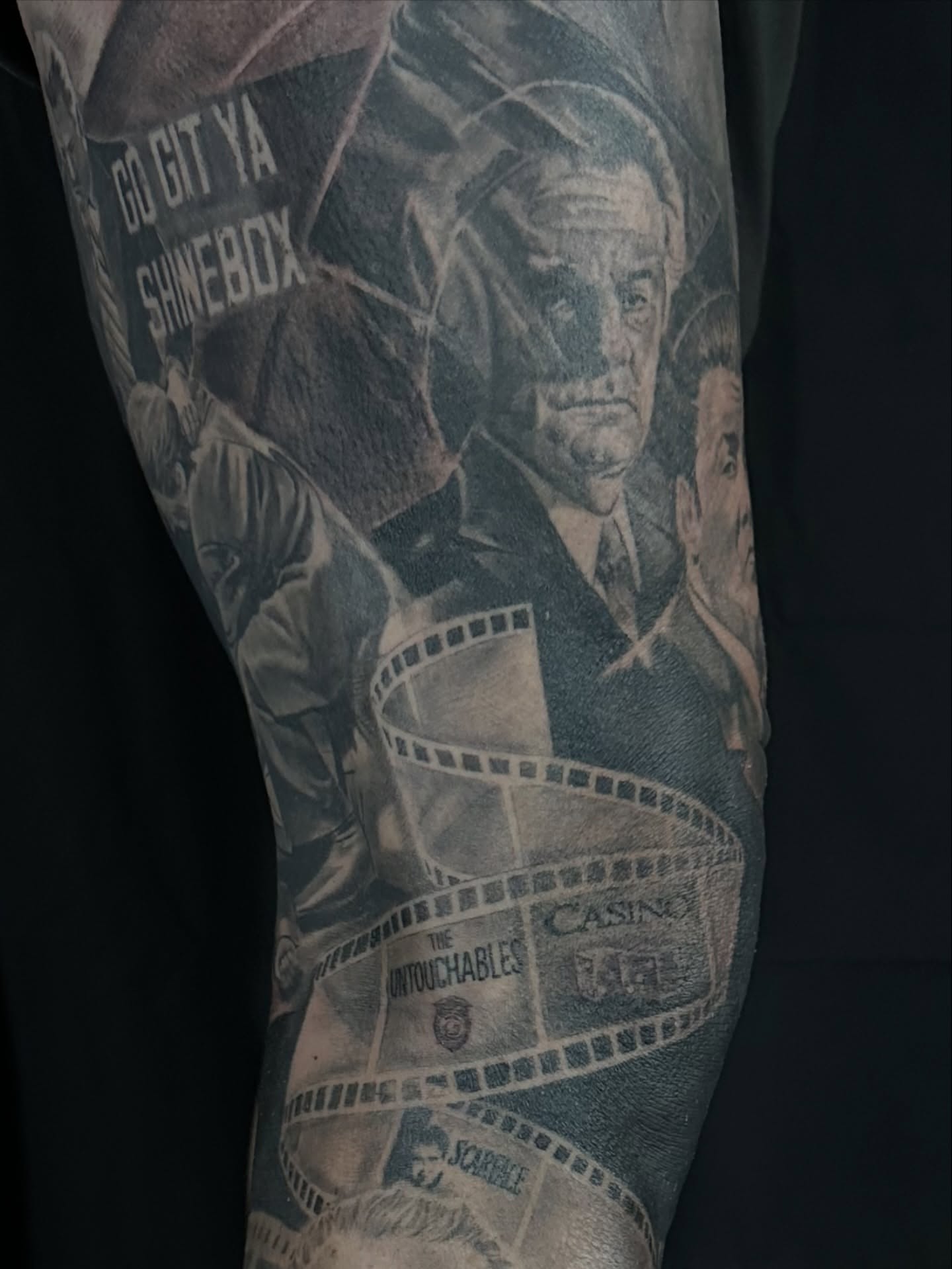 The untouchables black and grey tattoo on the forearm by Matthew Doherty