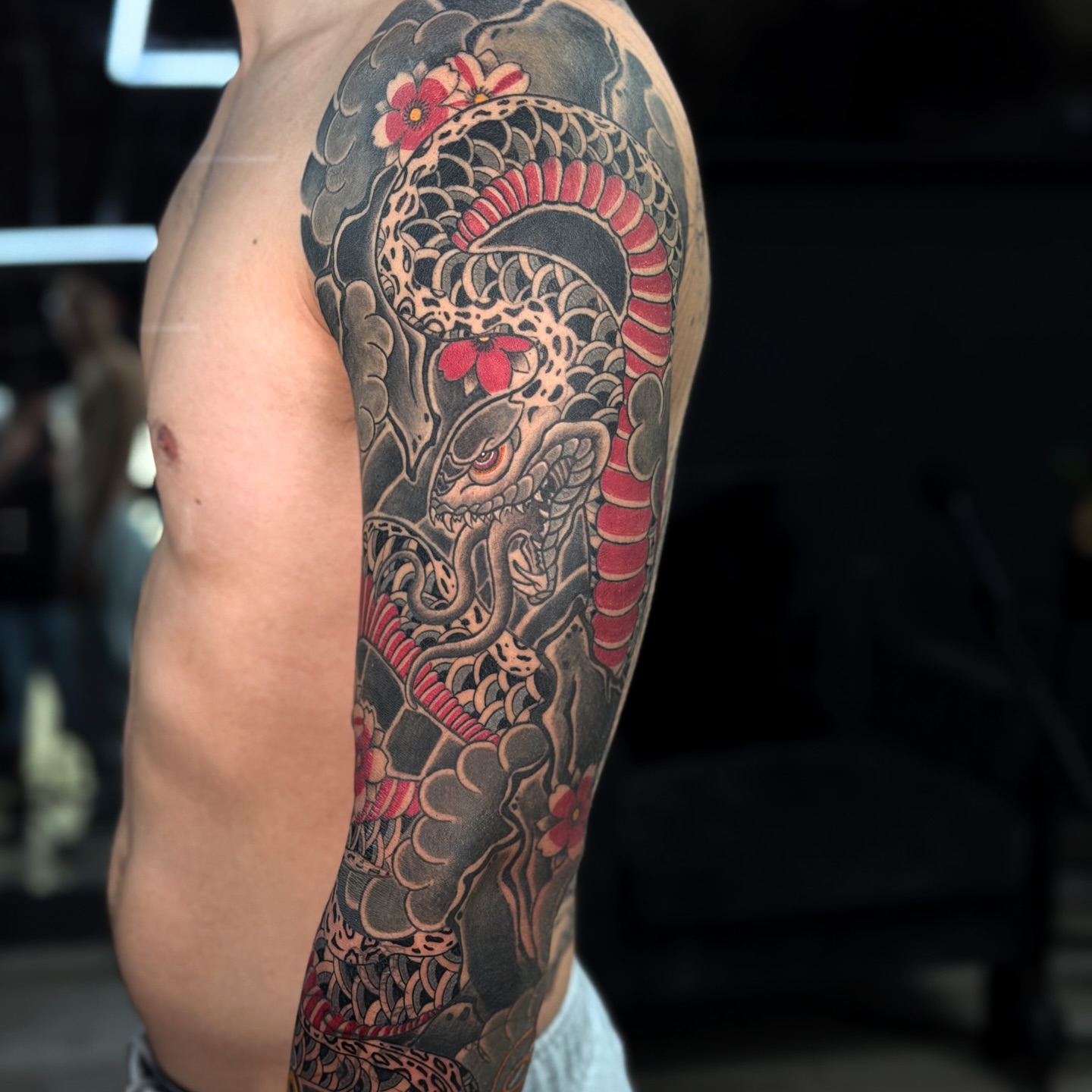 Snake and peony japanese irezumi tattoo on the forearm by Nicolas Herrera