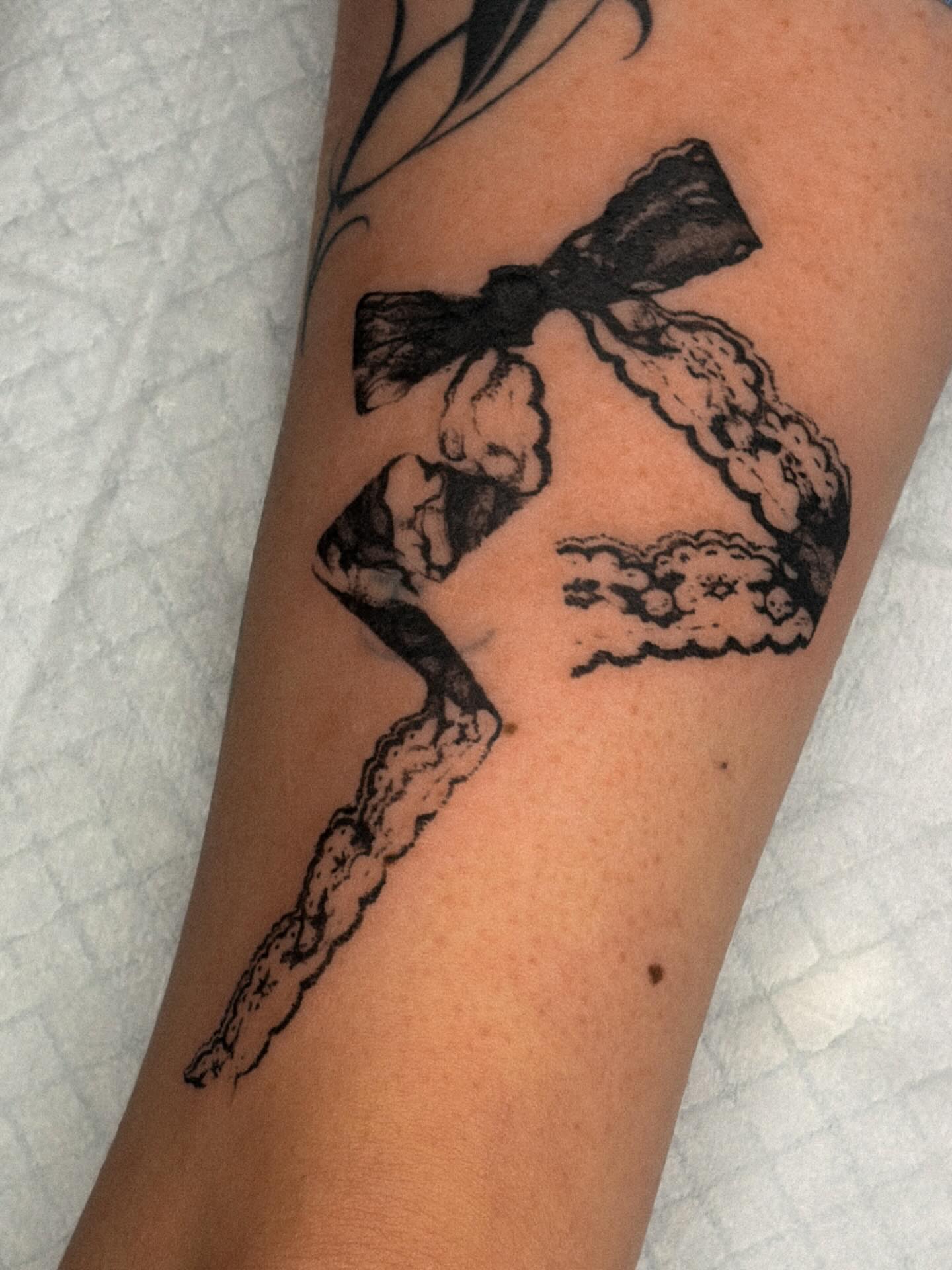 Bow and clouds black and grey tattoo on the forearm by ☆ gia