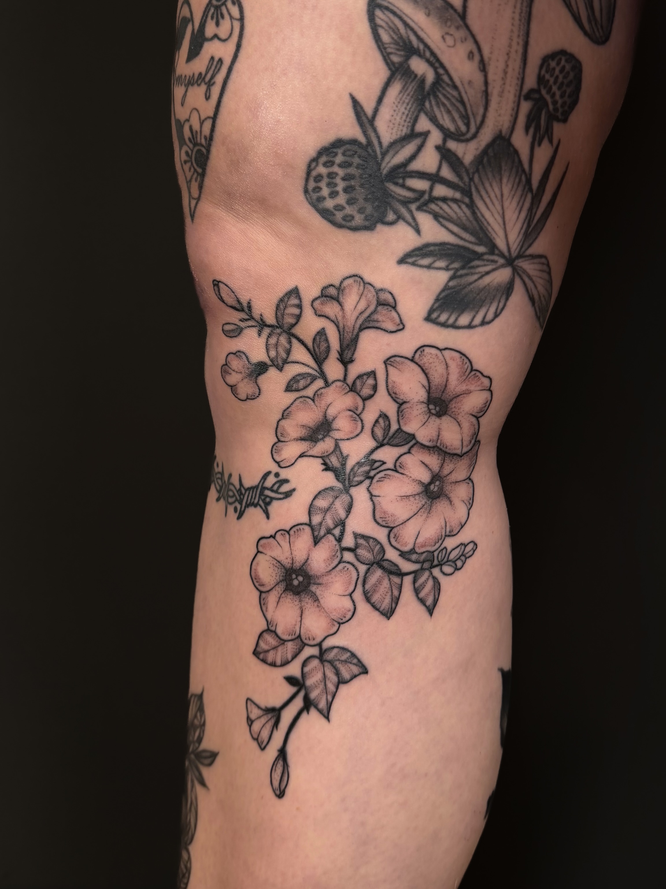 Flowers black and grey tattoo on the forearm by Hannah, Portland, Oregon
