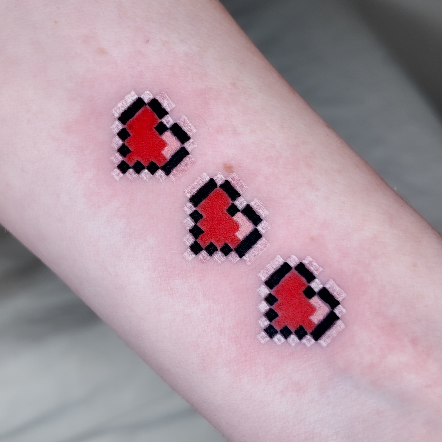 Pixelated heart dotwork tattoo on the forearm by m r p i x e l ๐ธ๐ฌ