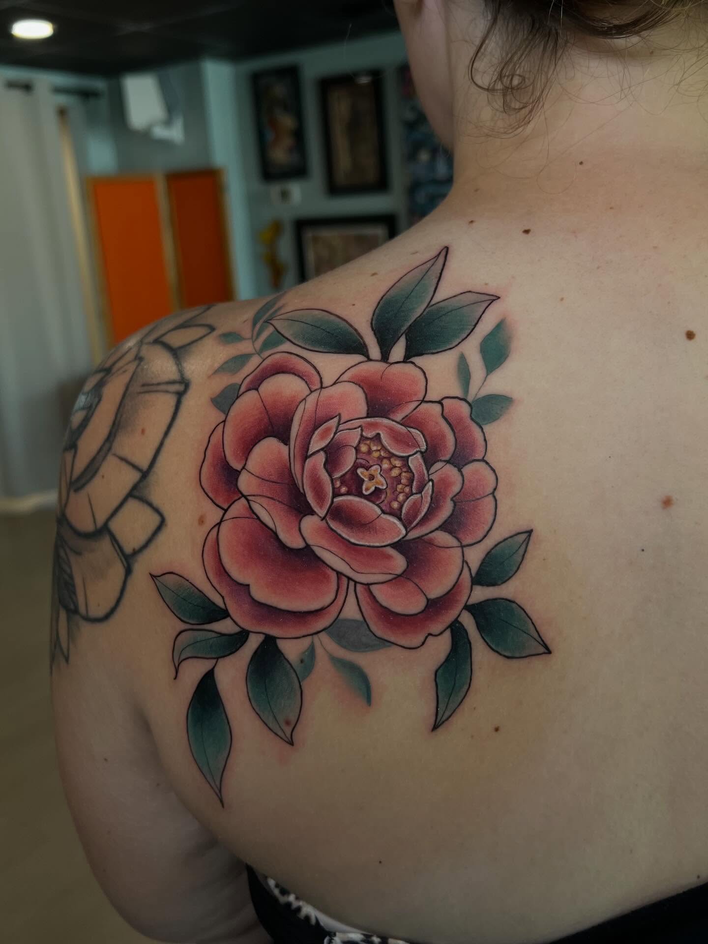 Peony American traditional tattoo on the shoulder by Jessica Kloos