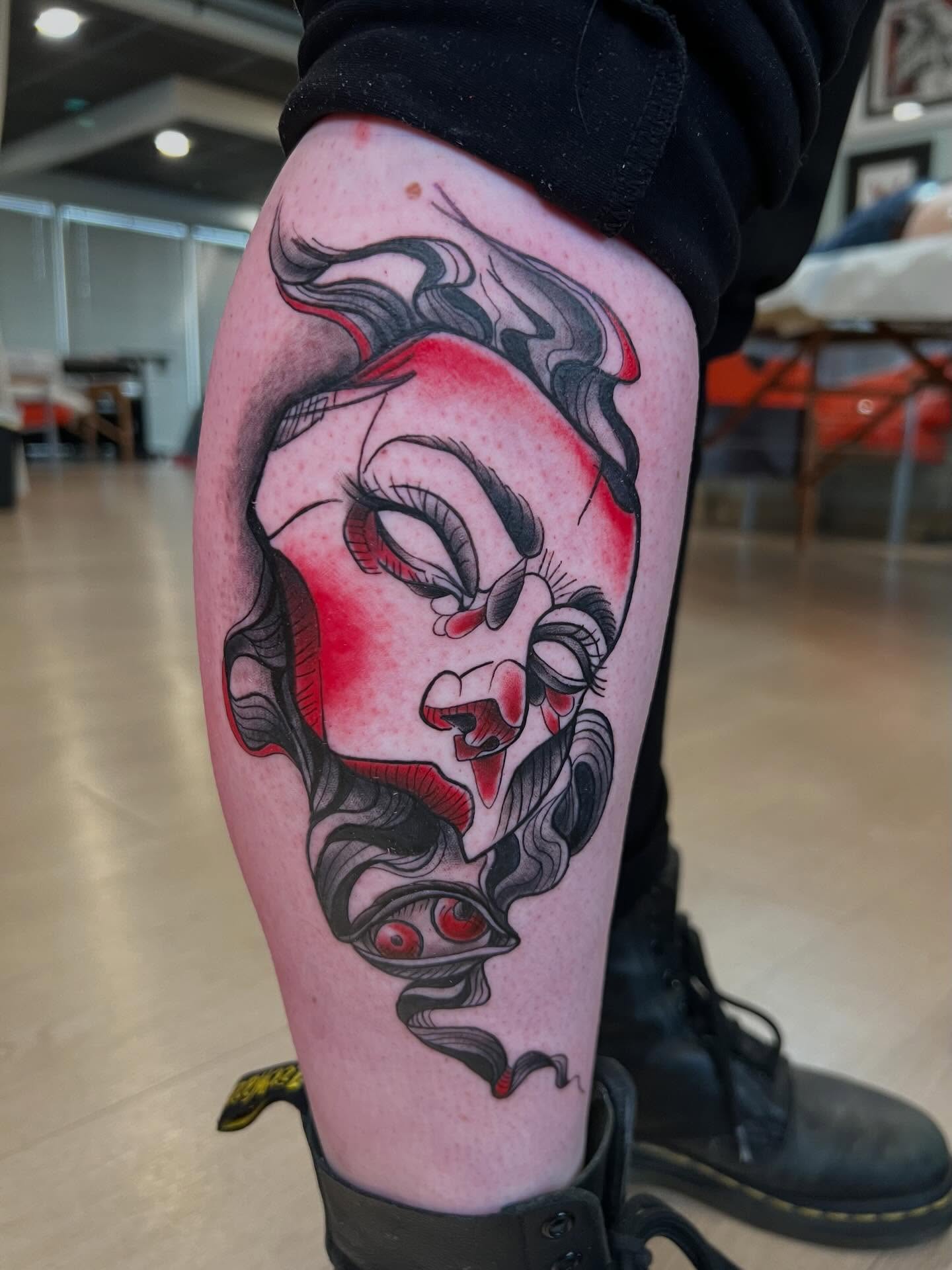 Woman's face American traditional tattoo on the leg by Jessica Kloos
