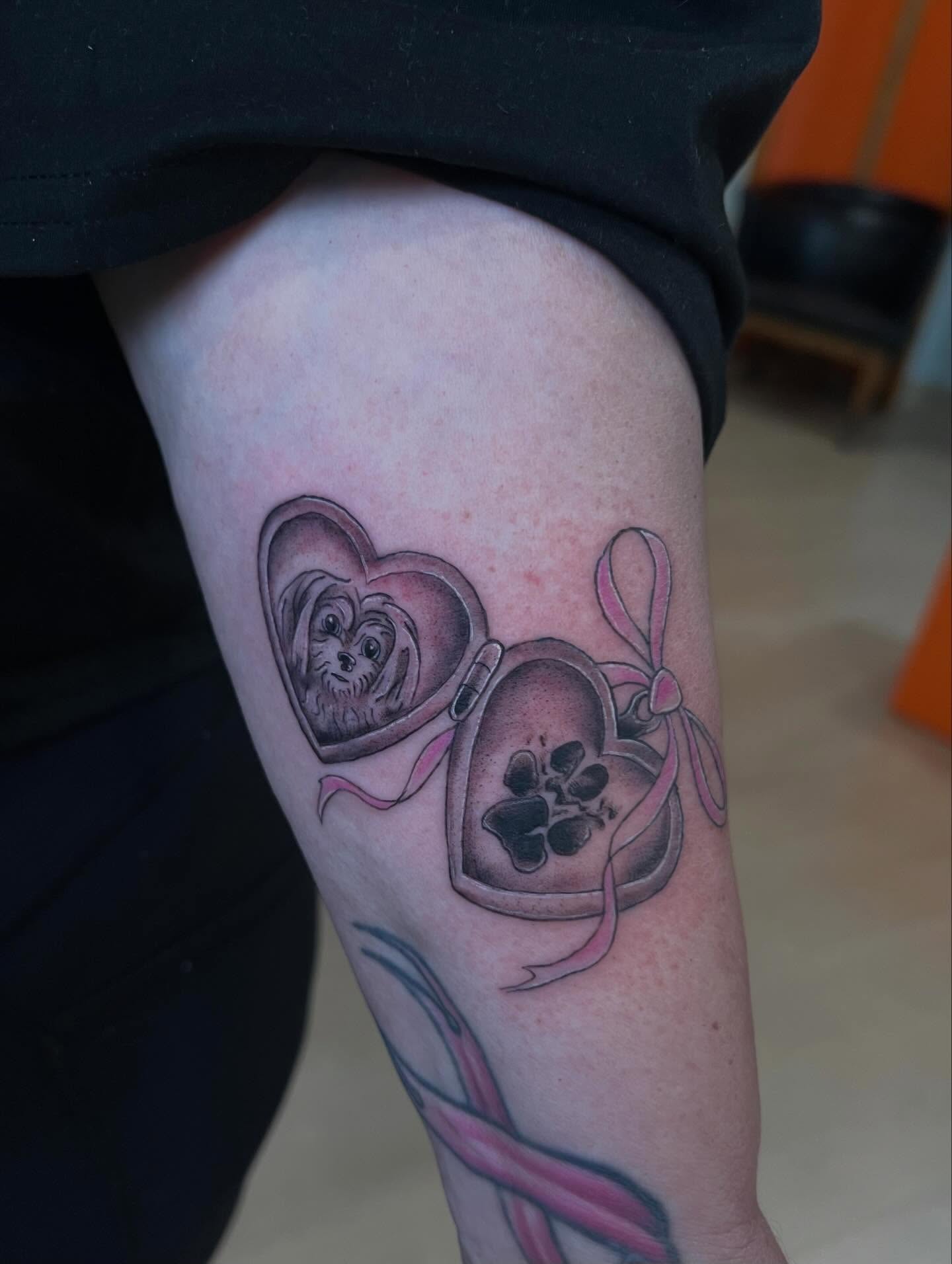 Dog in heart realism tattoo on the forearm by Jessica Kloos