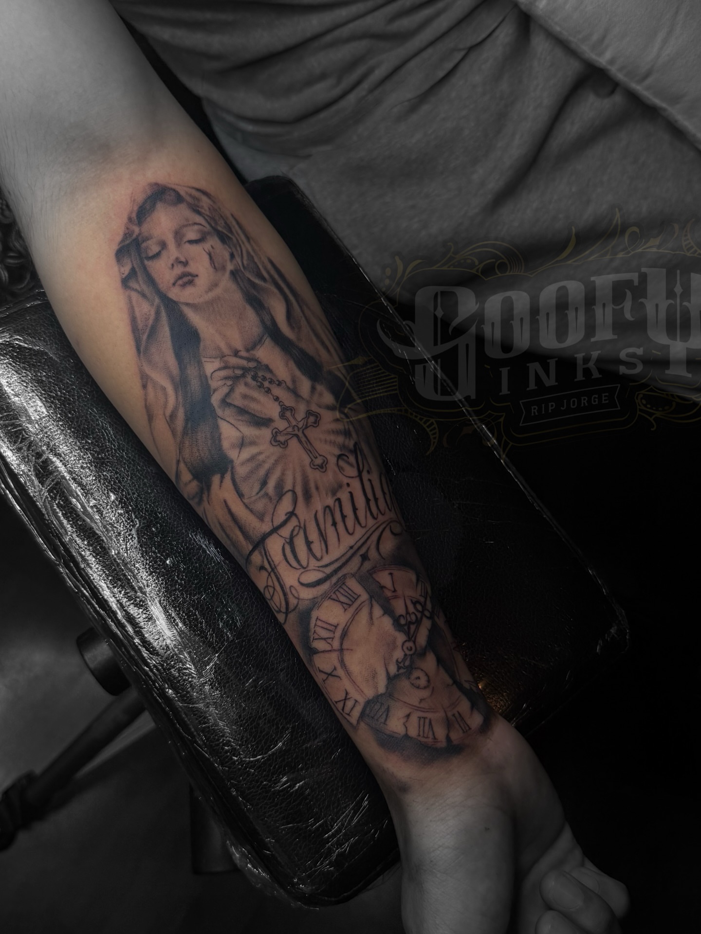 Religious figure black and grey tattoo on the forearm by Gooofy’s Ink 💸✍🏽 18+