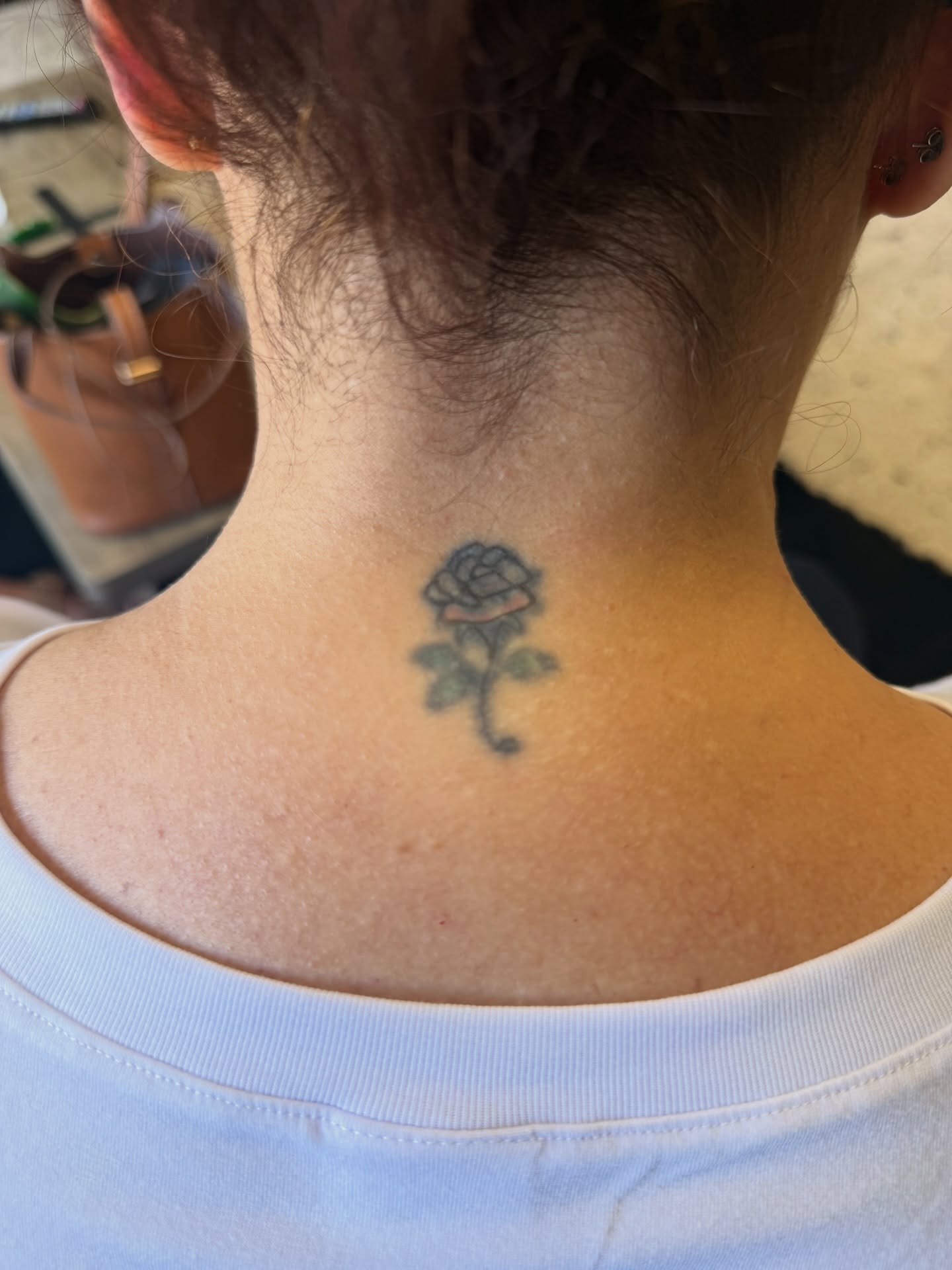 Rose black and grey tattoo on the neck by Raciel Fabian Romero