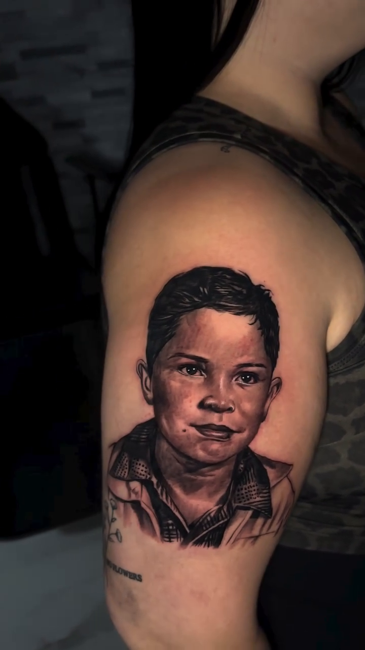 Tattoo by @tj_tattoos14 — realism, black_and_grey