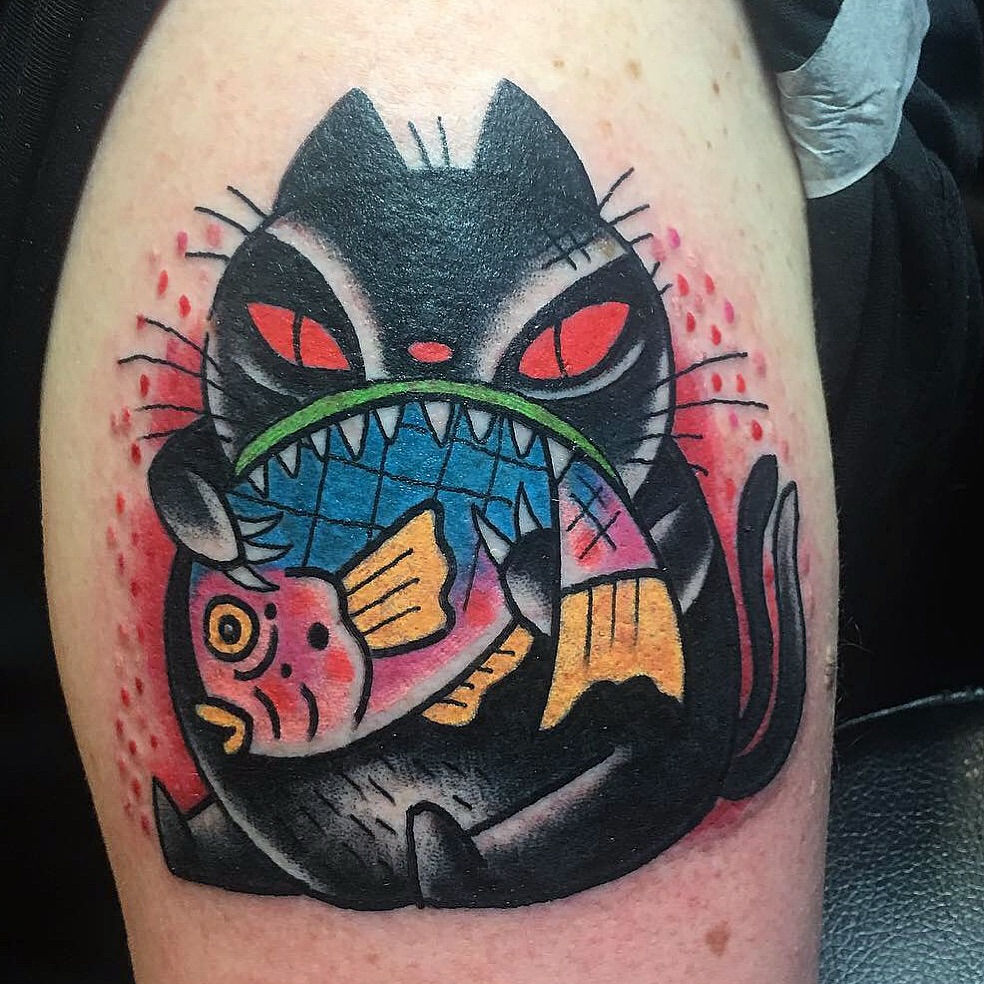 Cat American traditional tattoo on the thigh by Aidan Monahan Tattoo