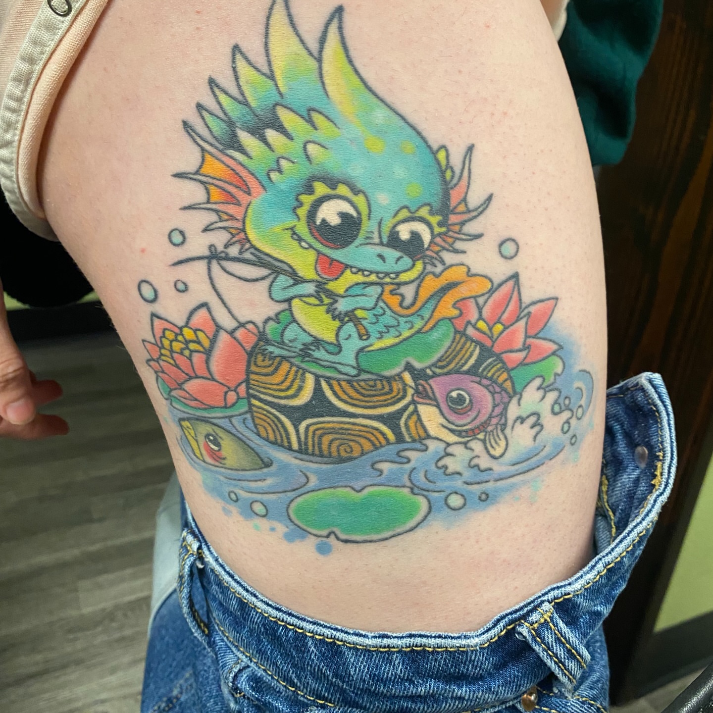 Dragon and lotus new school tattoo on the thigh by Aidan Monahan Tattoo
