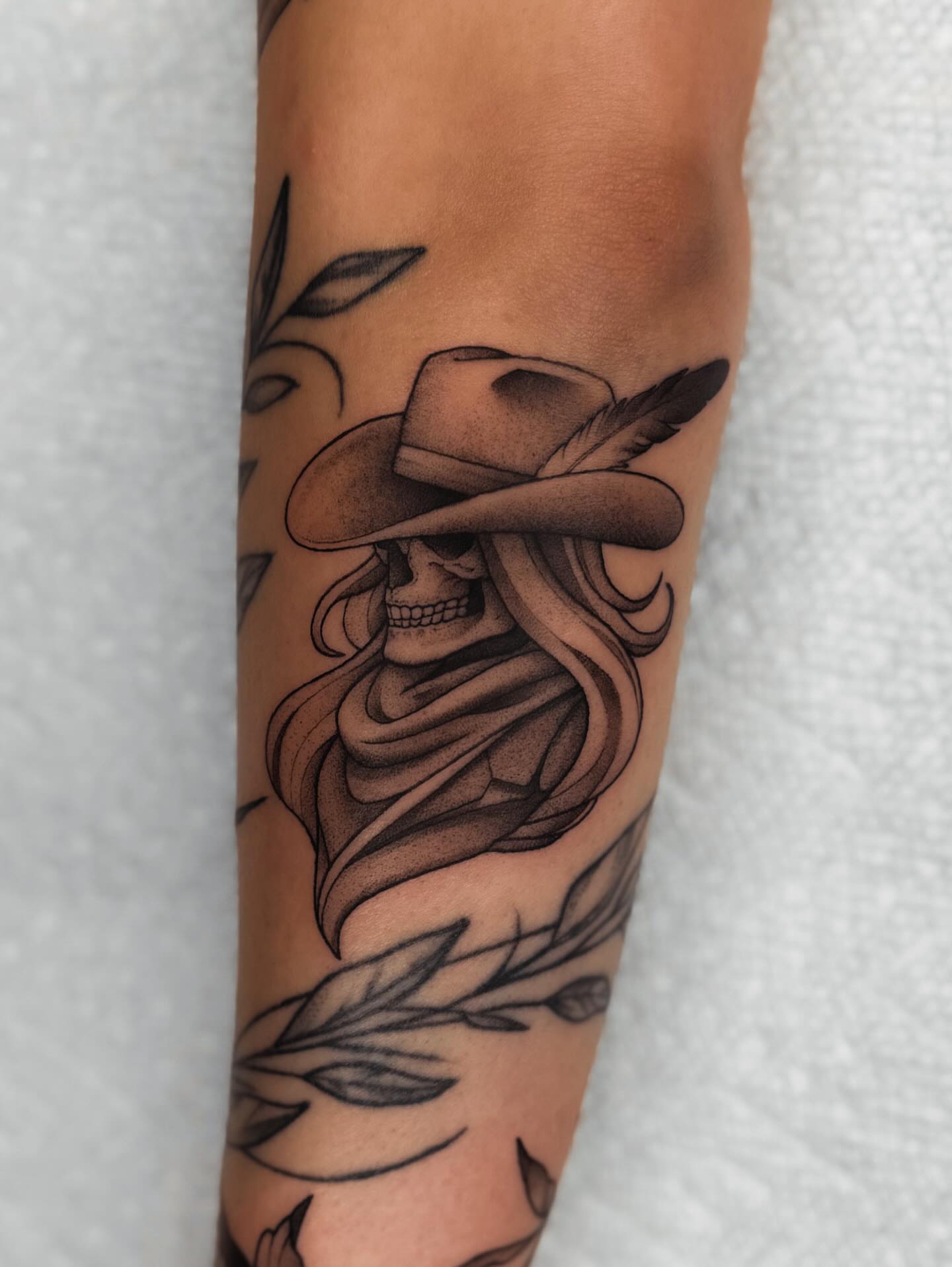 Cowboy skull black and grey tattoo on the forearm by 𝔍𝔞𝔯𝔢𝔡 𝔞𝔩𝔩𝔢𝔫