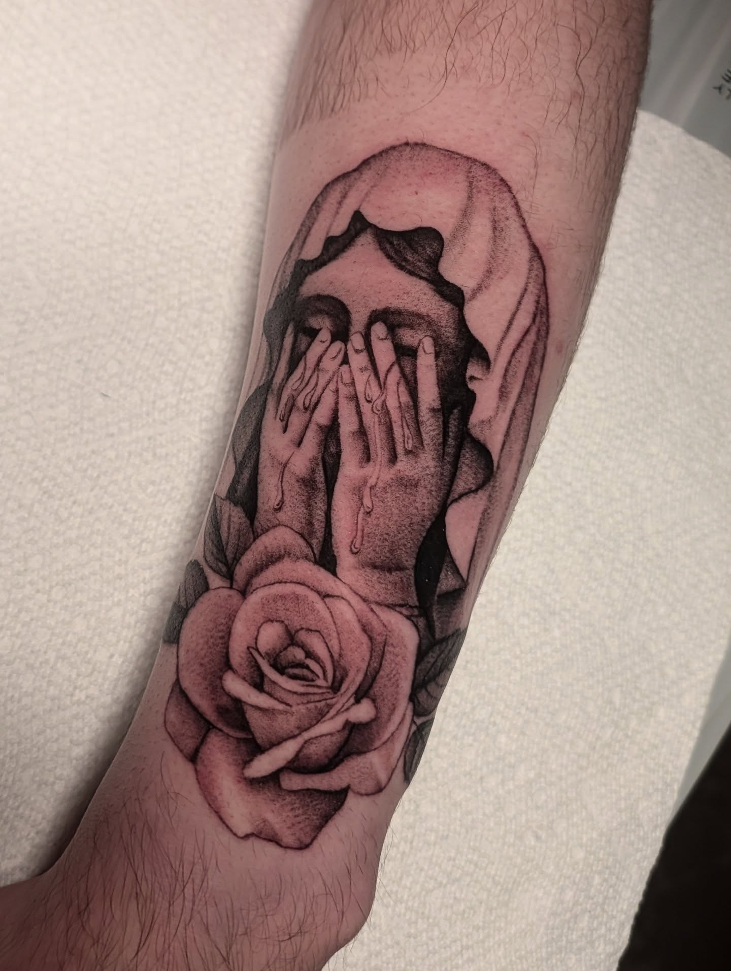 Hands covering face realism tattoo on the forearm by kylie, San Antonio, Texas