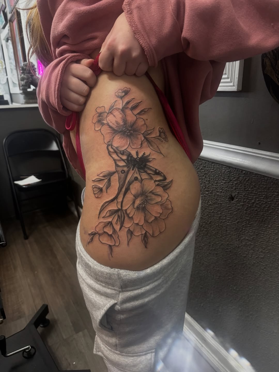 Moth and flowers fine line tattoo on the thigh by Lexy
