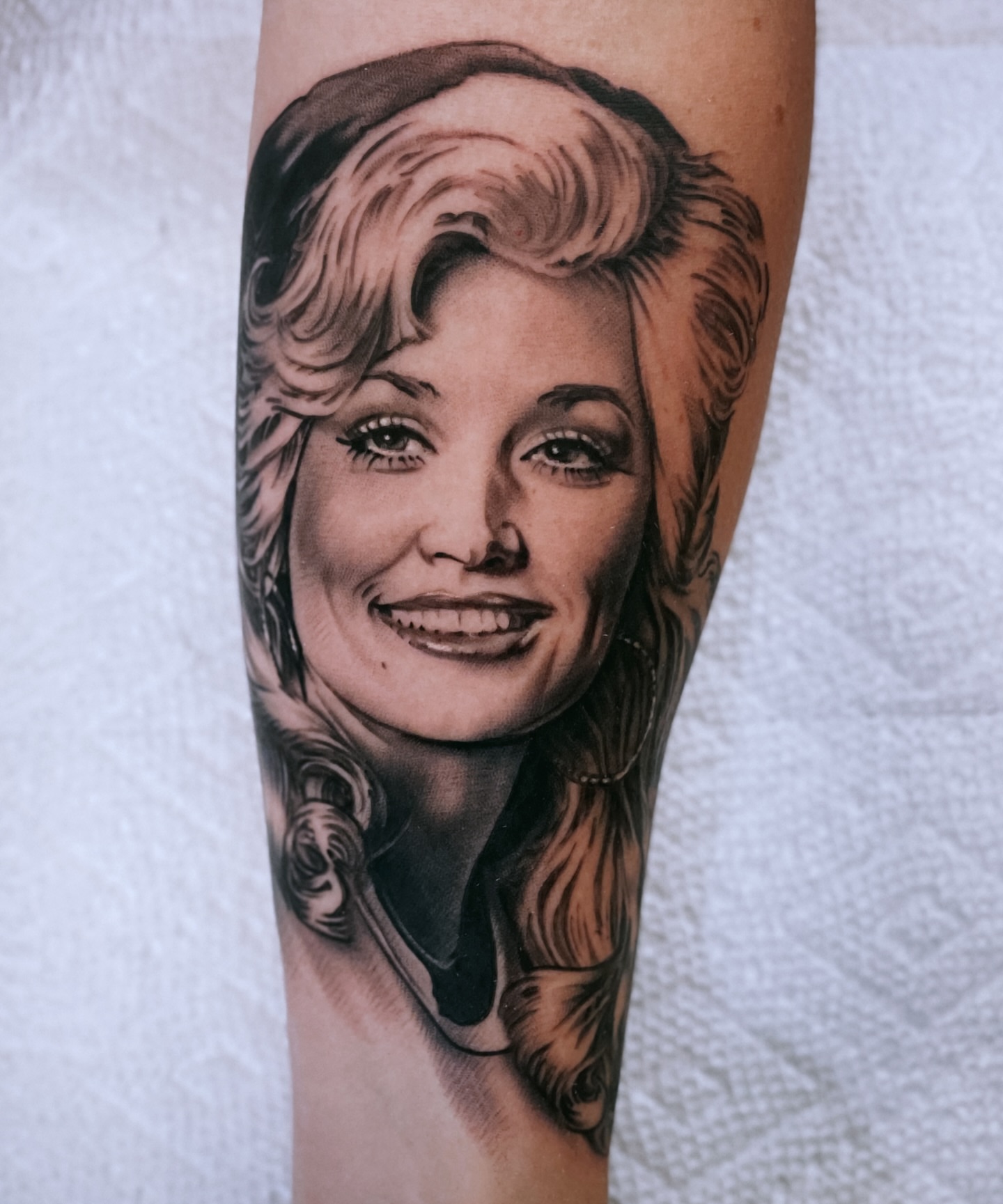Portrait realism tattoo on the forearm by Holly Ellis, San Francisco, California