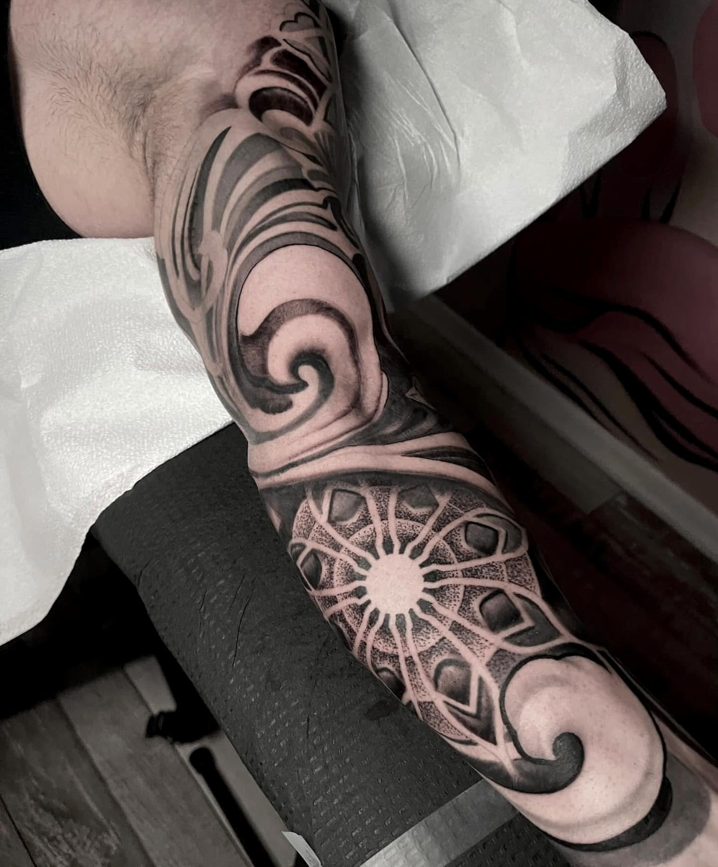 Geometric mandala dotwork tattoo on the forearm by Alex Rockoff