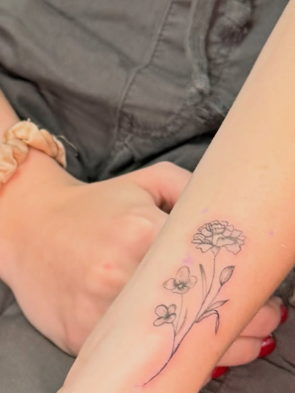 Flowers black and grey tattoo on the forearm by JAmy Winters