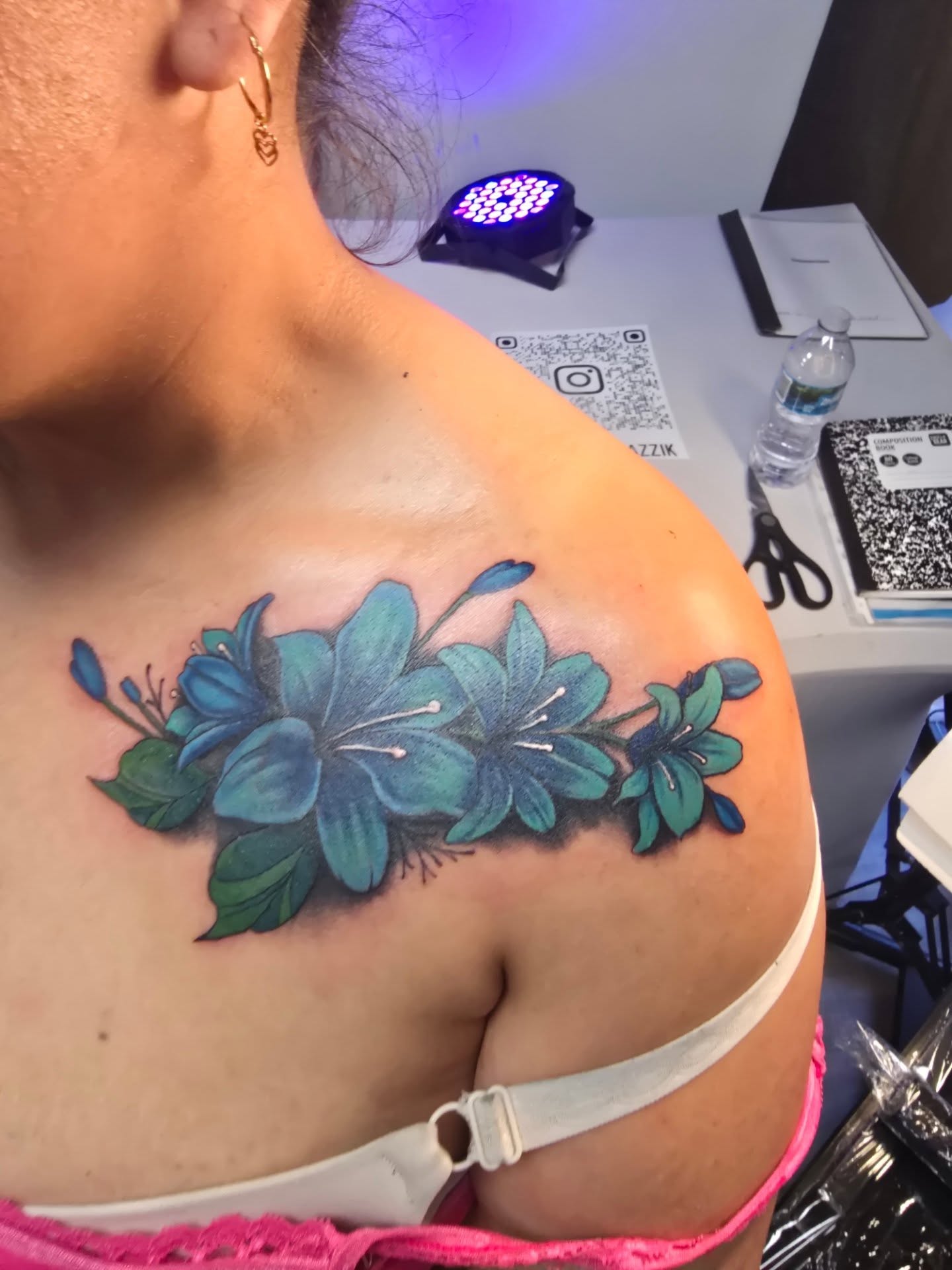 Blue flowers realism tattoo on the shoulder by Klazzik Mayfield, Fort Lauderdale, Florida