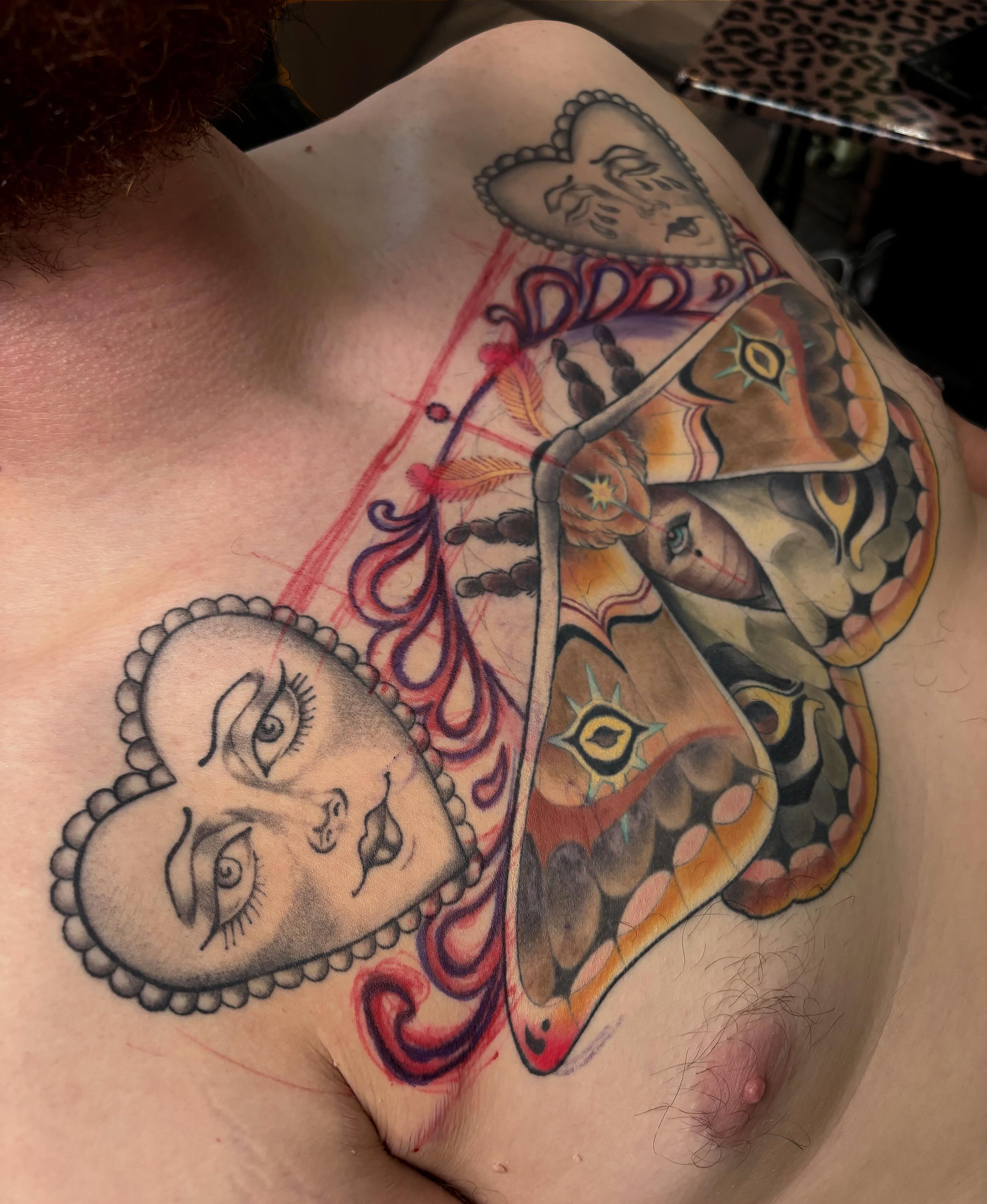 Mask and butterfly American traditional tattoo on the shoulder by Alex