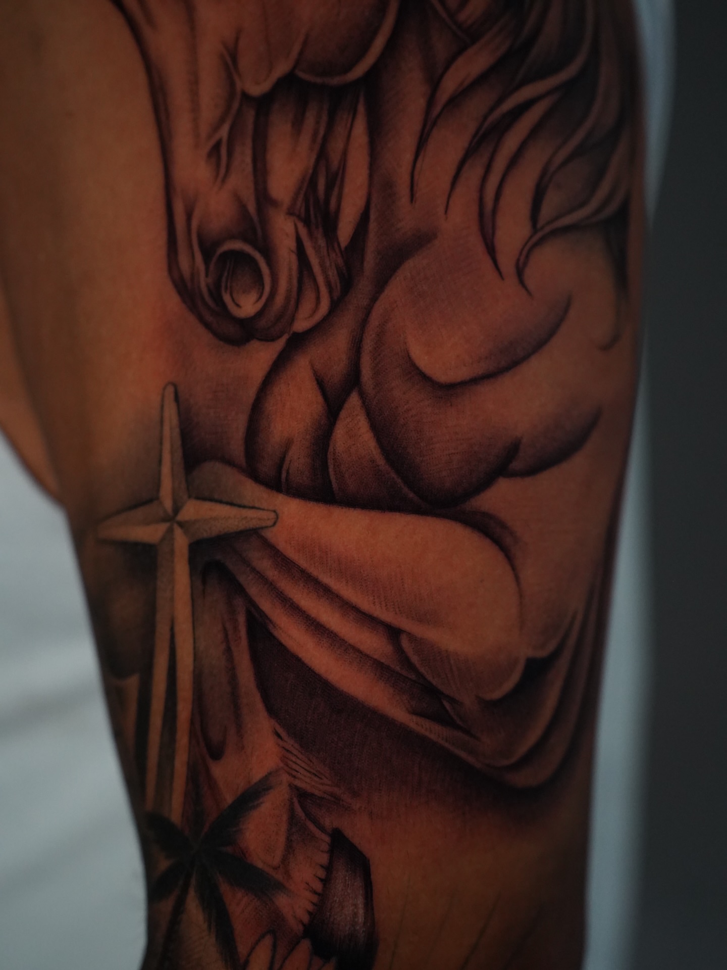 Muscular figure with sword realism tattoo on the forearm by Dallas Tattoo Artist