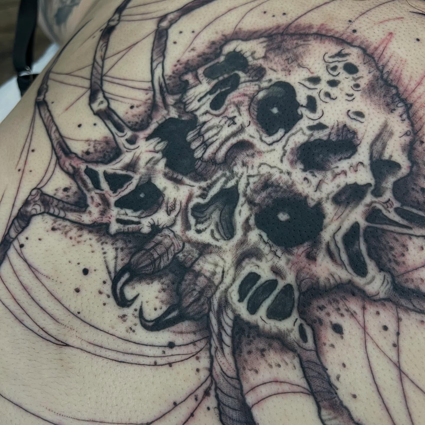 Skulls dotwork tattoo on the back by Brianna Jo Ballinghoff
