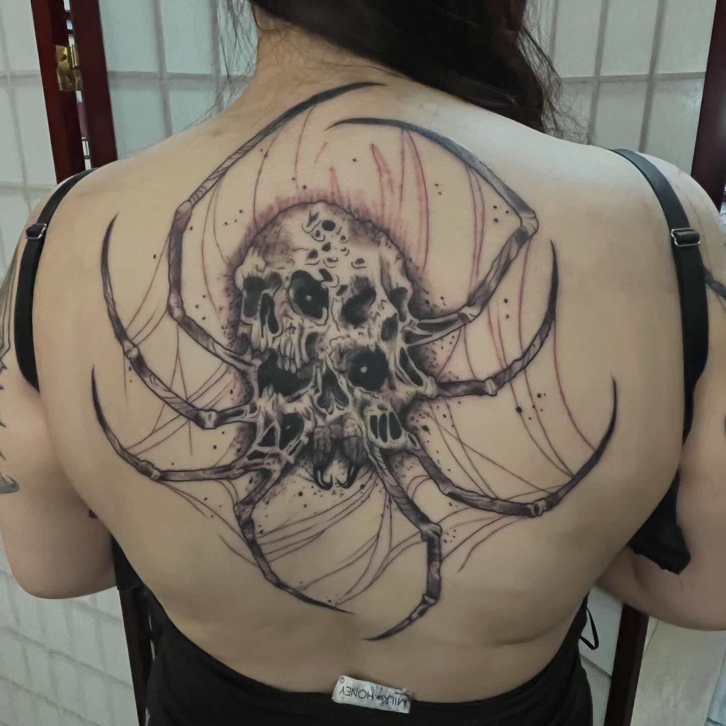 Skull dark realism tattoo on the back by Brianna Jo Ballinghoff
