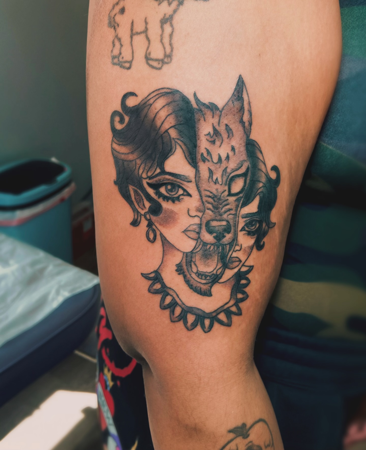 Woman with wolf realism tattoo on the forearm by Shay Cole