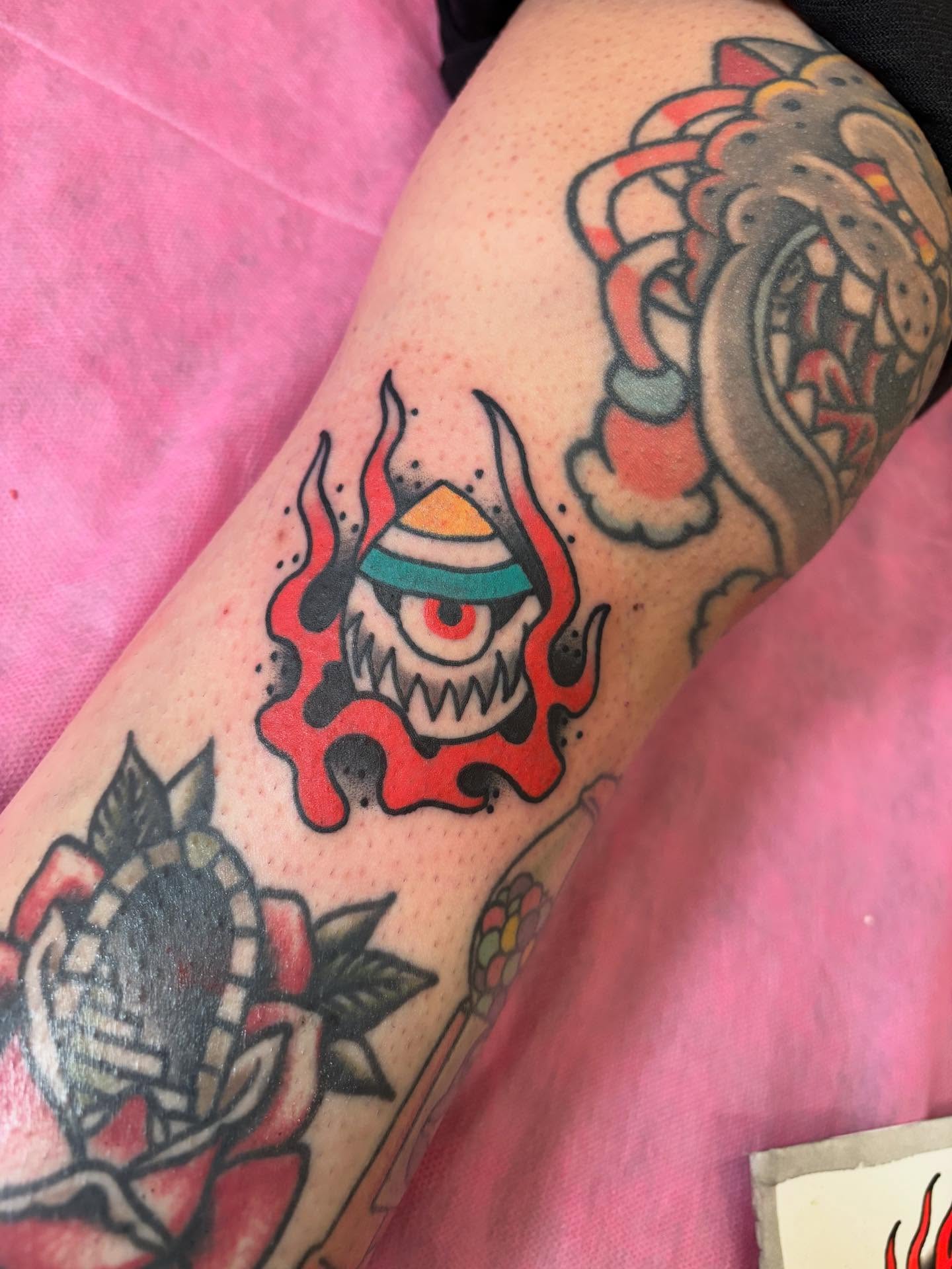 Eye with flames American traditional tattoo on the forearm by Tyler Whalen