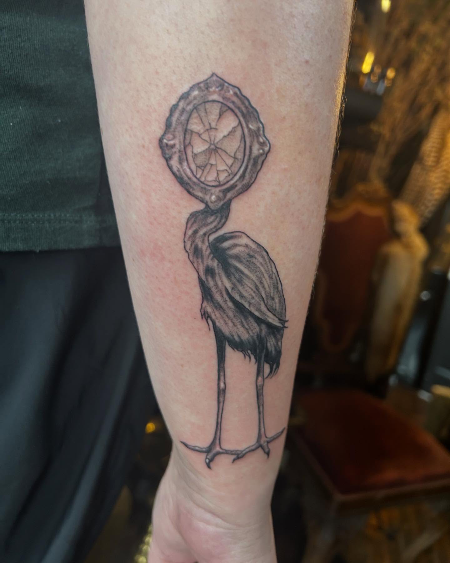 Heron with clock black and grey tattoo on the forearm by ๐๐๐๐๐๐ ๐๐๐๐๐๐ ๐๐๐๐๐๐
