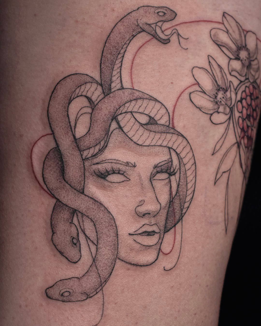 Medusa realism tattoo on the thigh by Erin Isaacs