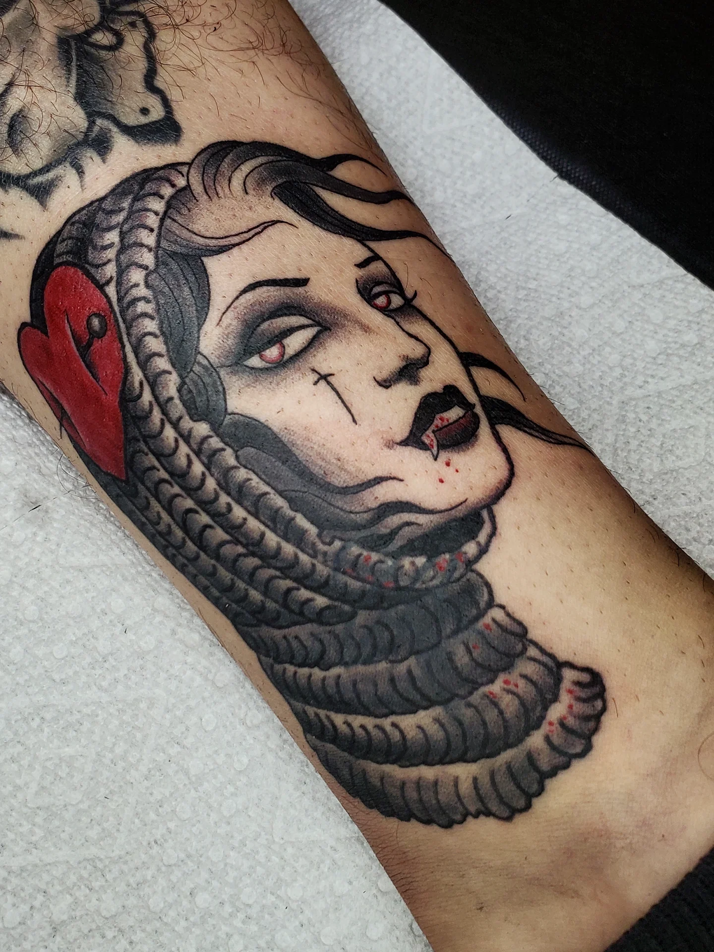 Woman with snake American traditional tattoo on the forearm by ✙ 𝐉𝐃 𝐒𝐩𝐫𝐨𝐮𝐥 ✙, Austin, Texas