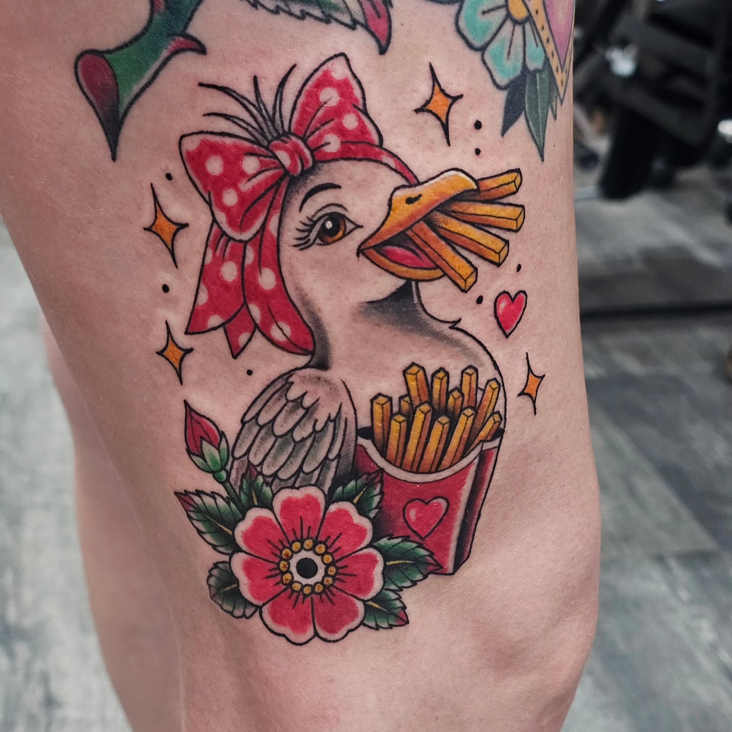 Duck with fries American traditional tattoo on the forearm by Matthew Ashmore