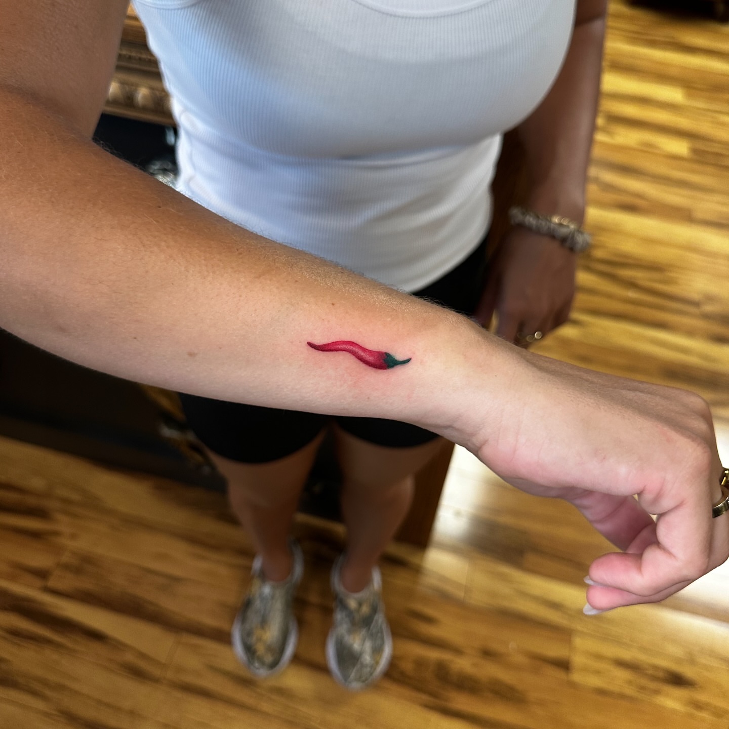 Chili pepper realism tattoo on the forearm by Leo Fernandes, Danvers, Massachusetts