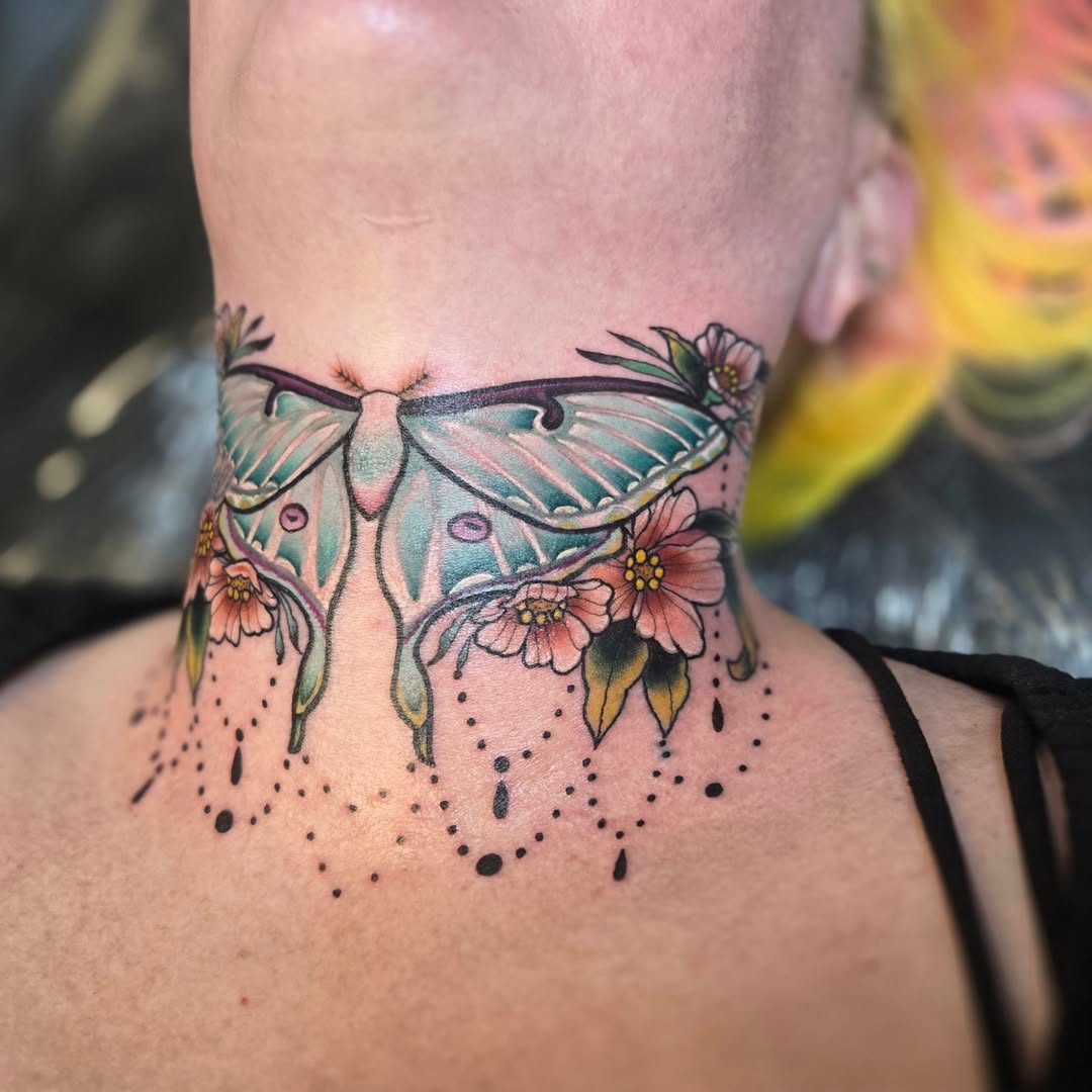 Butterfly and flowers dotwork tattoo on the neck by Angel O'Connor Tattoos