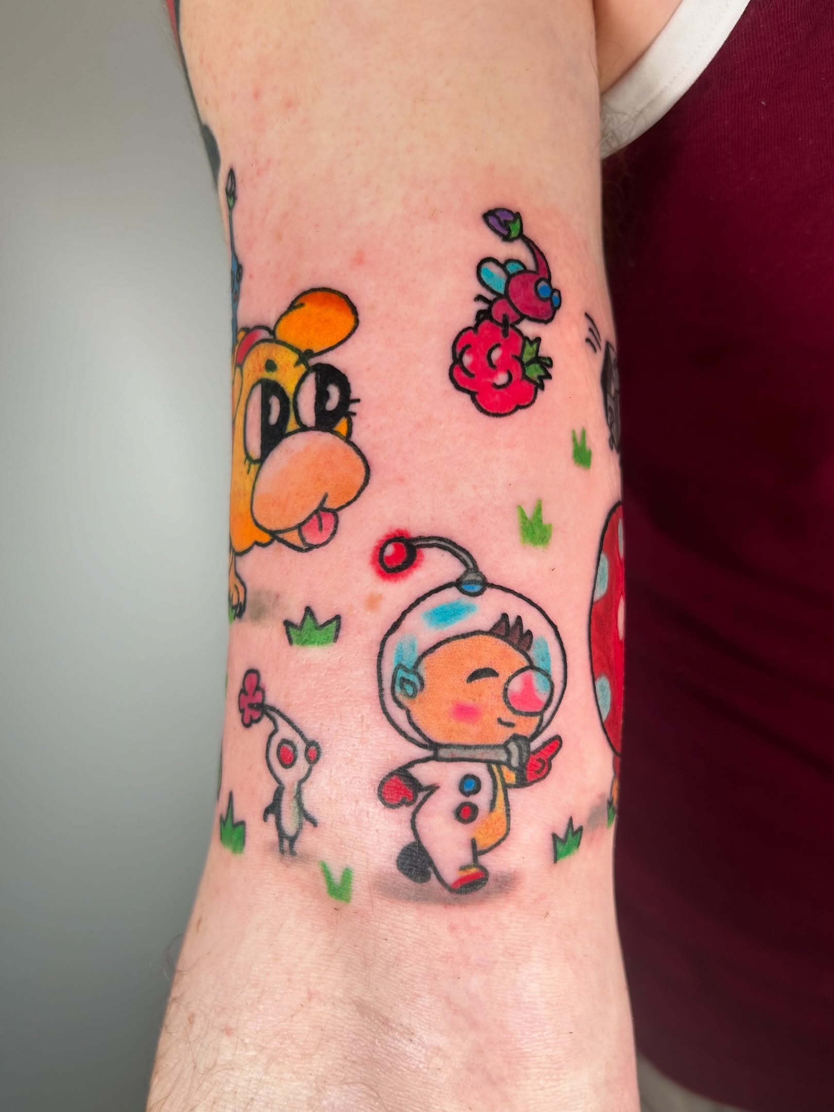 Space-themed characters new school tattoo on the forearm by Ollie