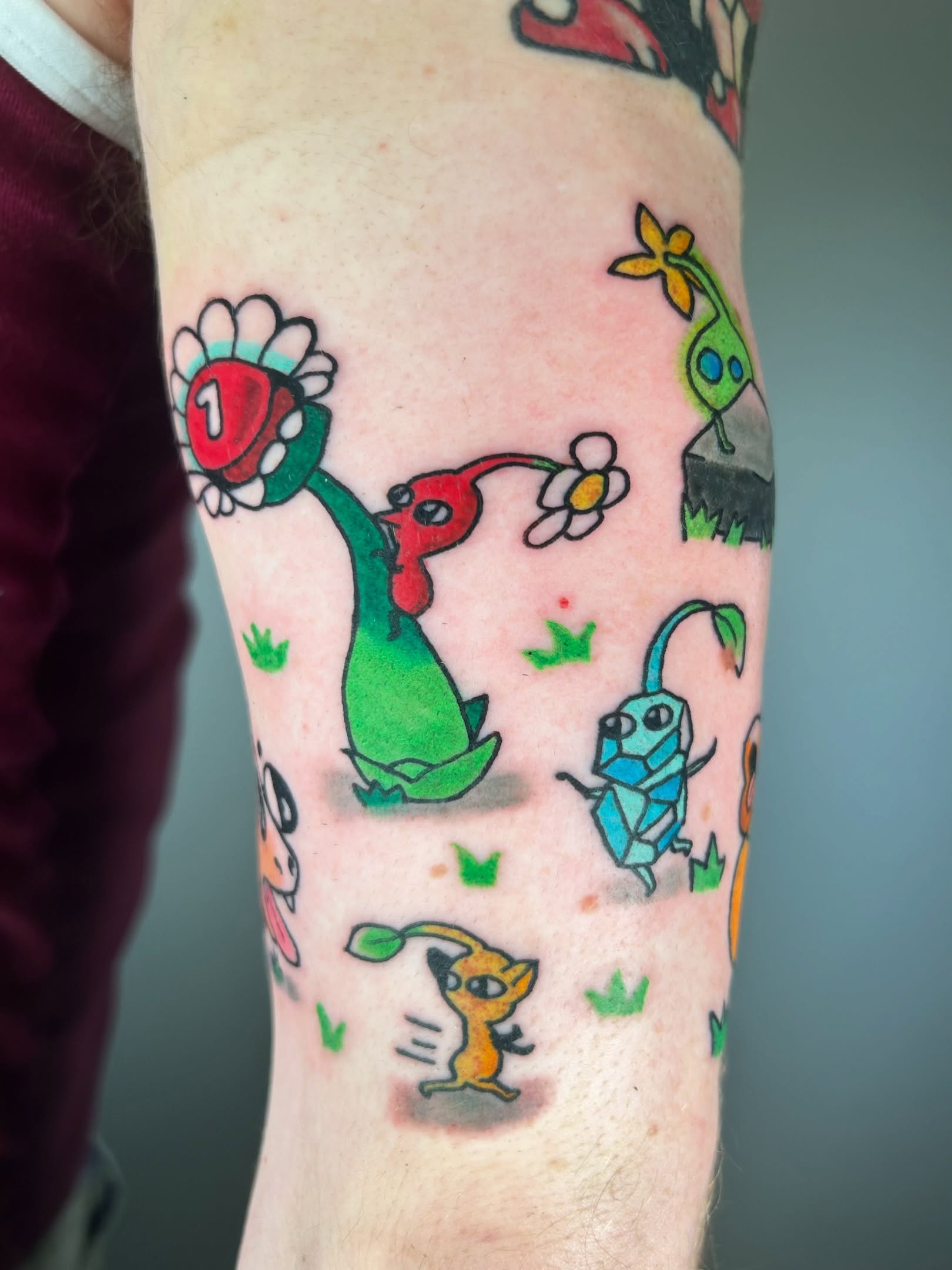 Cartoon characters American traditional tattoo on the forearm by Ollie