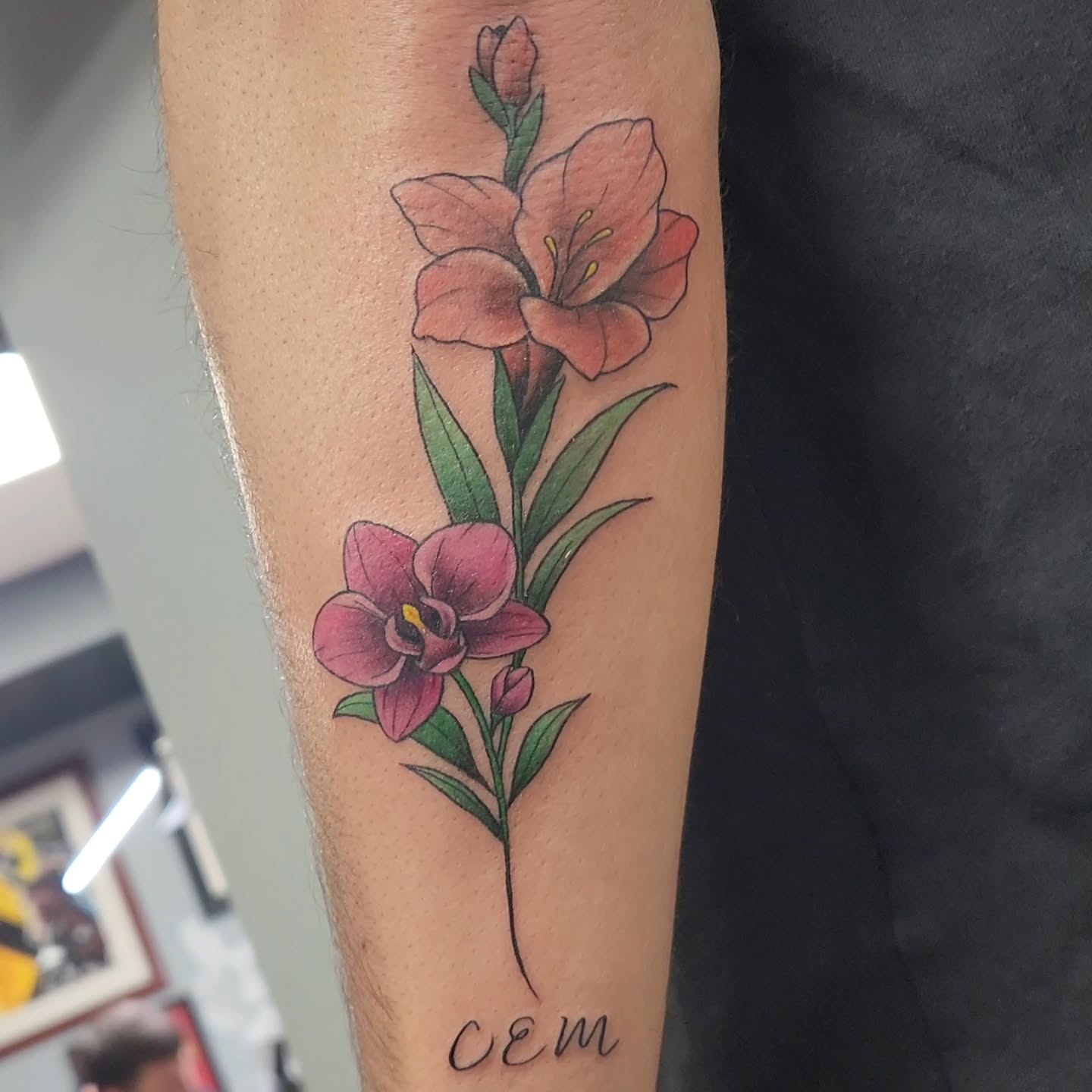 Gladiolus flowers realism tattoo on the forearm by Jason August