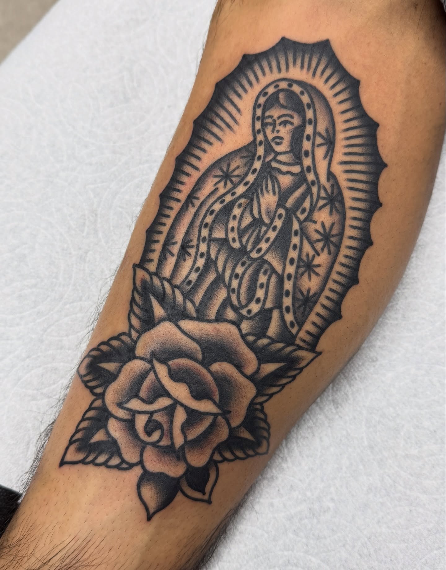 Our Lady of Guadalupe American traditional tattoo on the forearm by Joey Burdette Tattoos