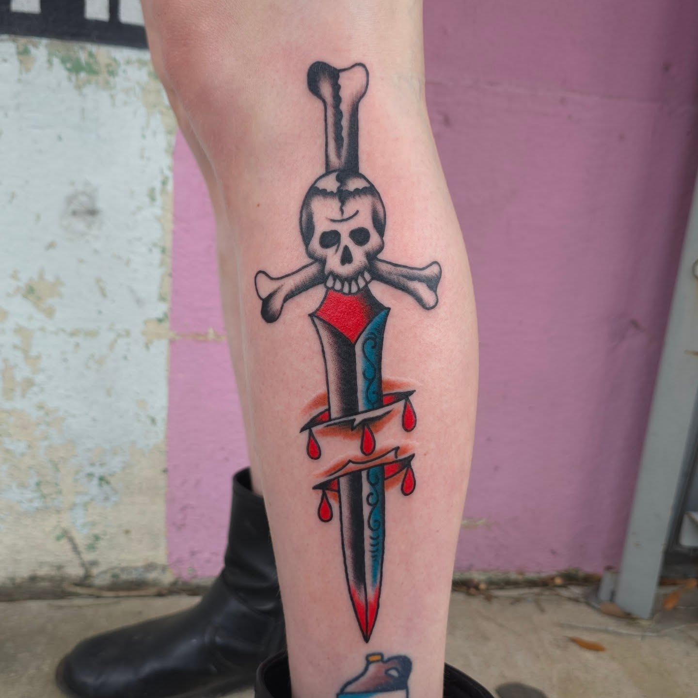 Sword and skull American traditional tattoo on the forearm by Jared Green