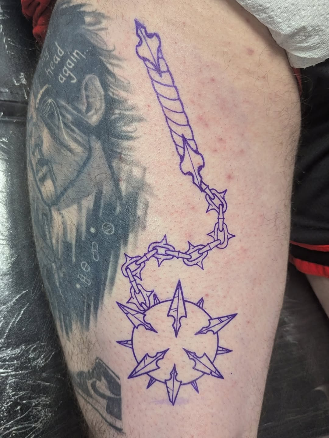 Flail weapon tattoo on the thigh by Payton