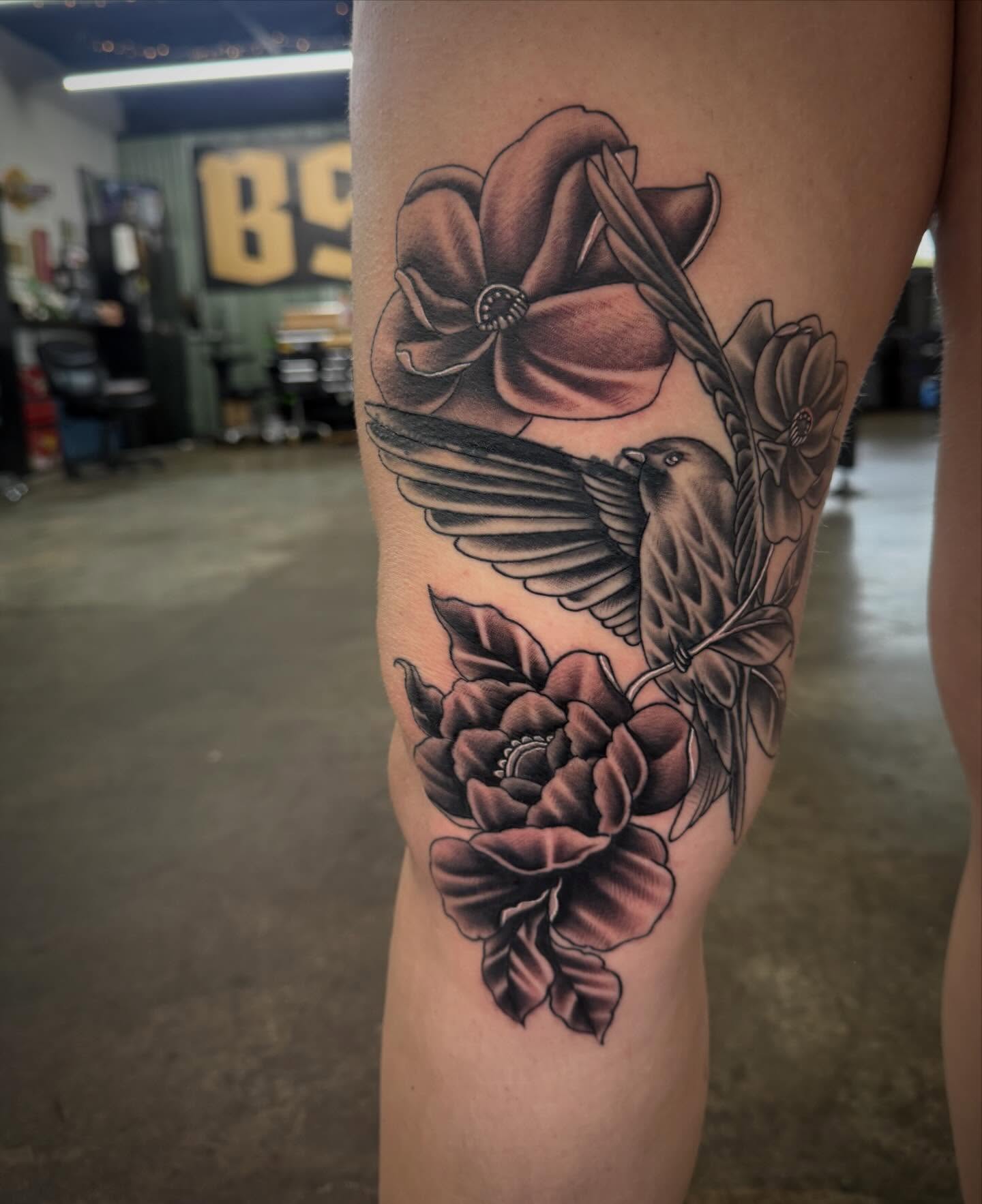 Peony and bird realism tattoo on the thigh by Jake Horstman, Dayton, Ohio