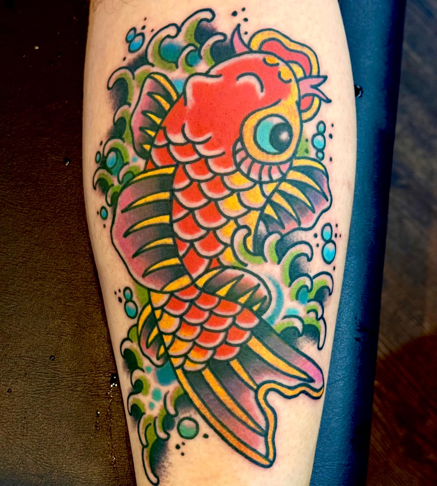 Koi fish American traditional tattoo on the forearm by Sam Hambrick, Watchung NJ