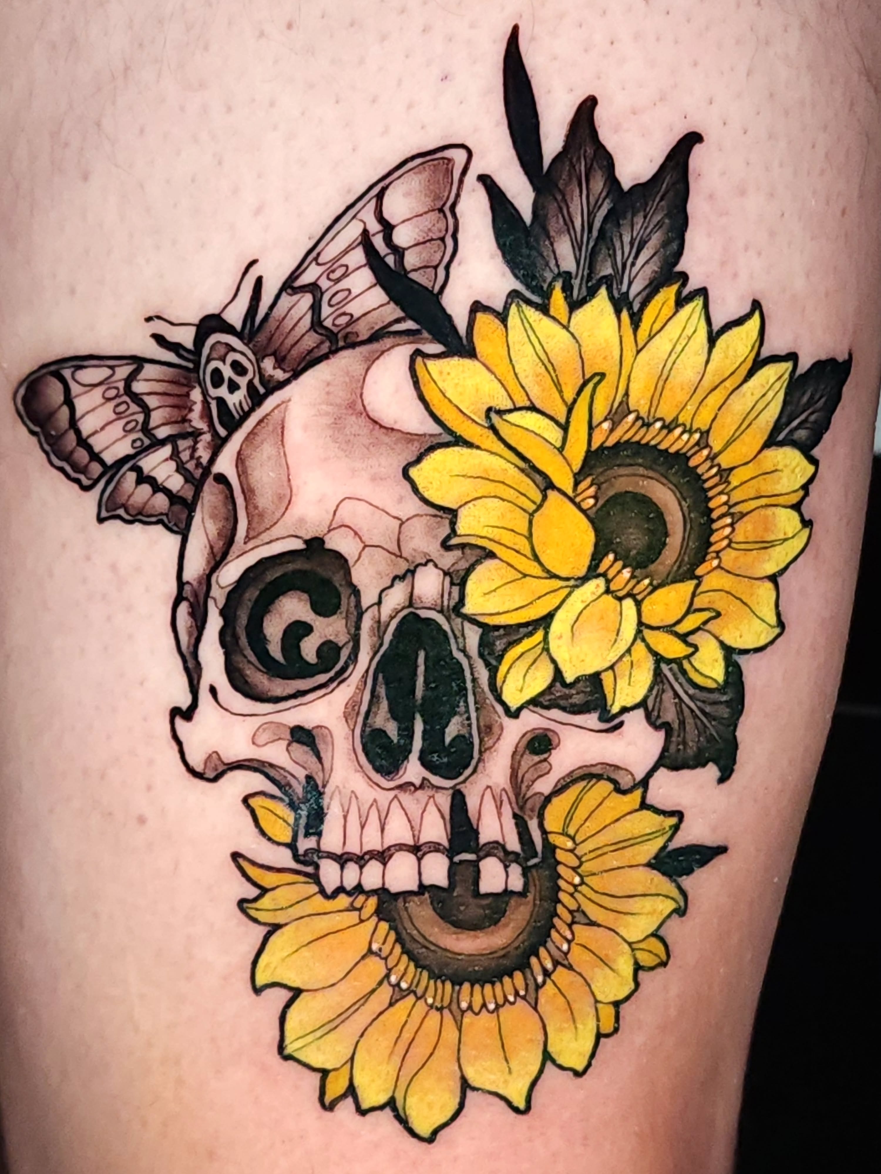 Sunflower skull American traditional tattoo on the thigh by Mario Romero