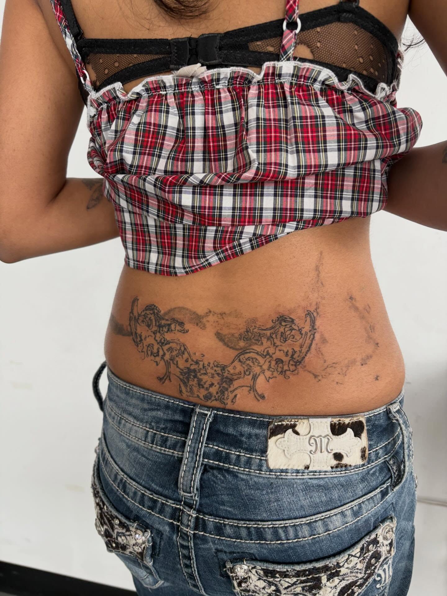 Floral design black and grey tattoo on the torso by madeline