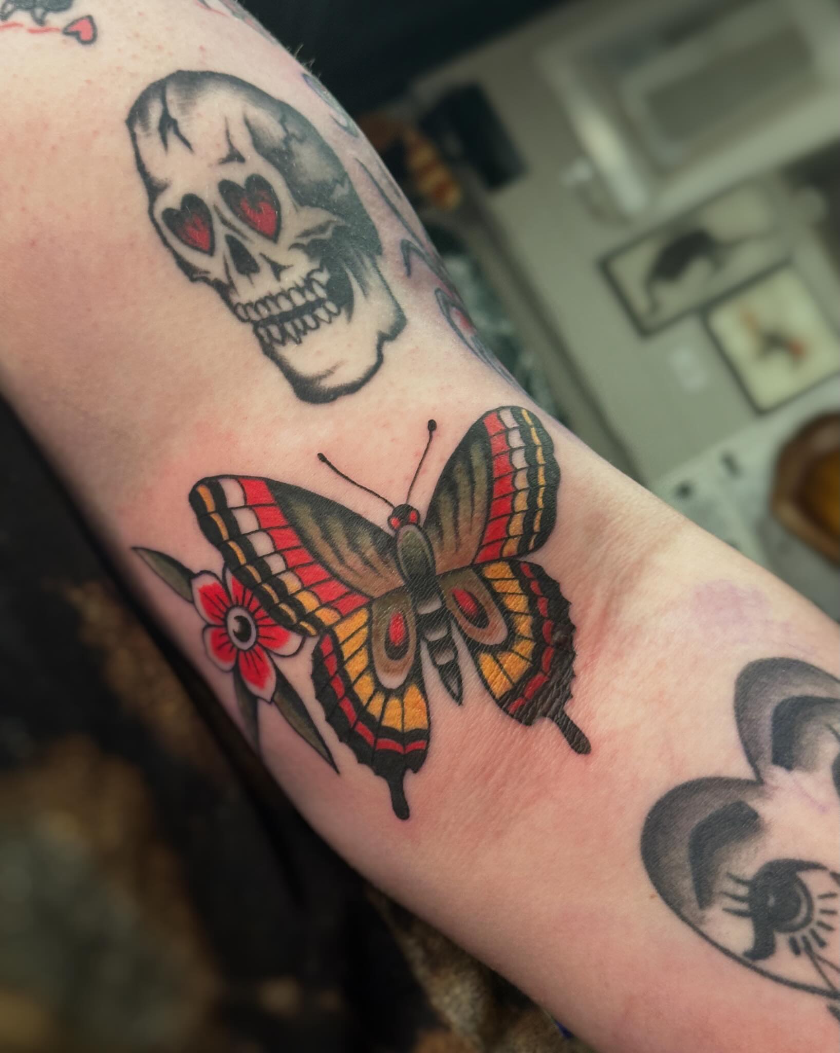 Butterfly American traditional tattoo on the forearm by Craig Ryans